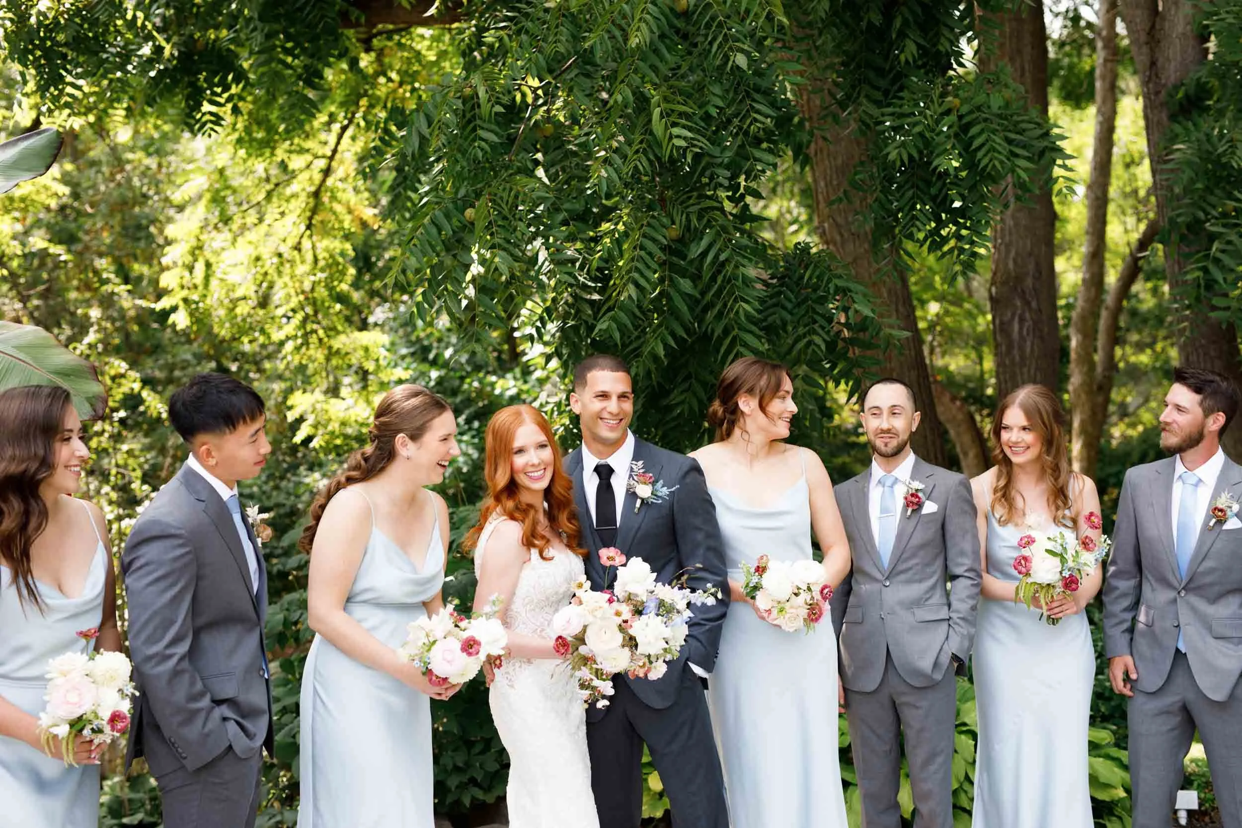 Bridal party laughing together at The Doctor’s House in Kleinburg, Ontario