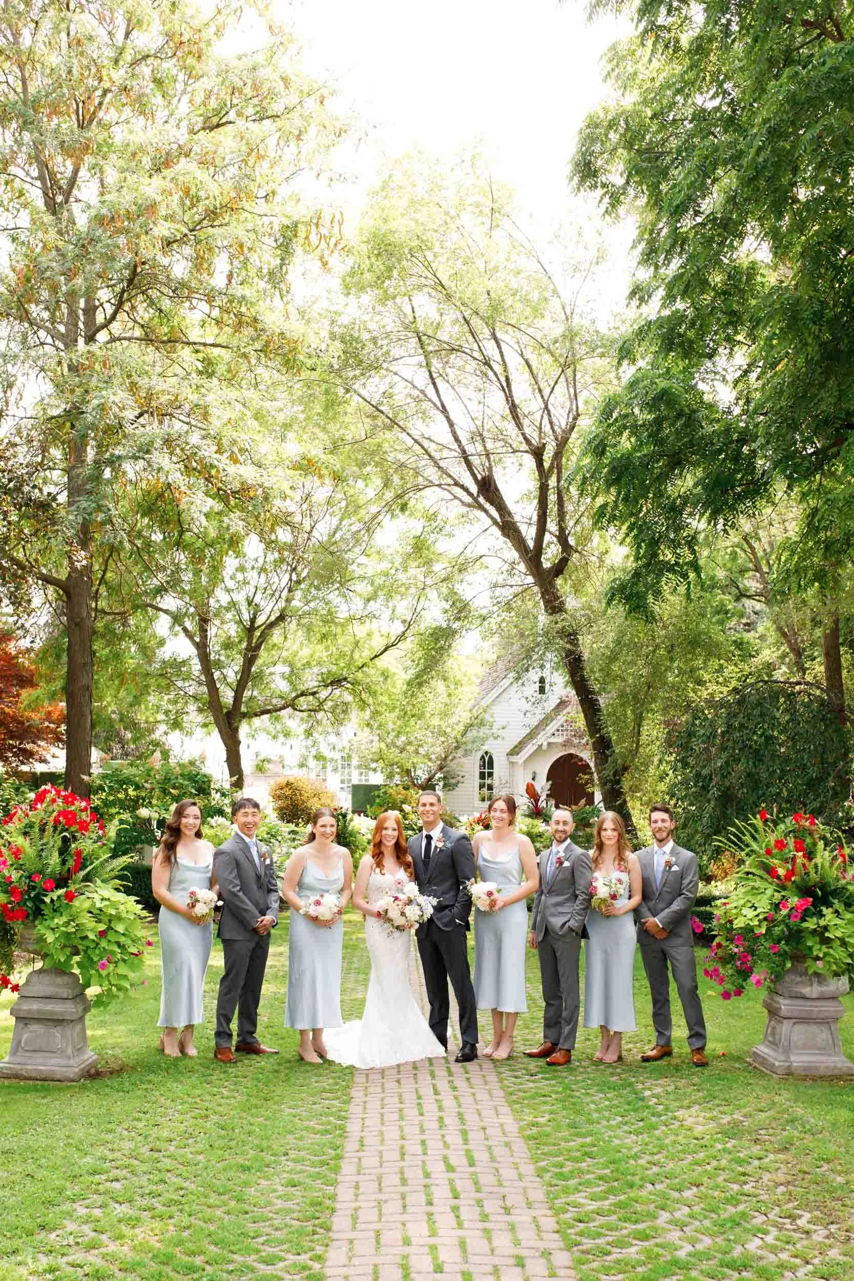 Bridal party on garden path at The Doctor’s House in Kleinburg