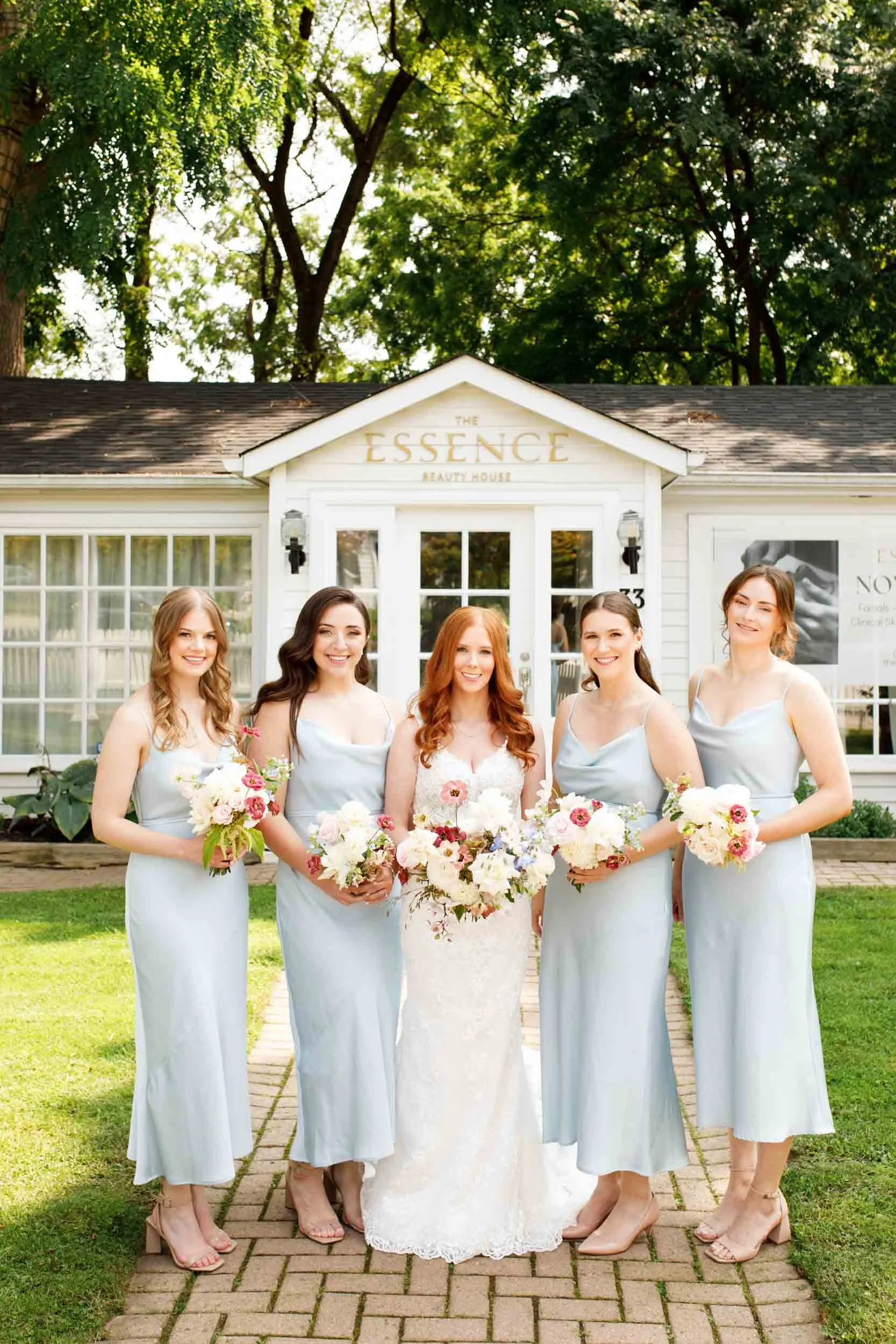 Bridesmaids standing together at The Doctor’s House in Kleinburg, Ontario