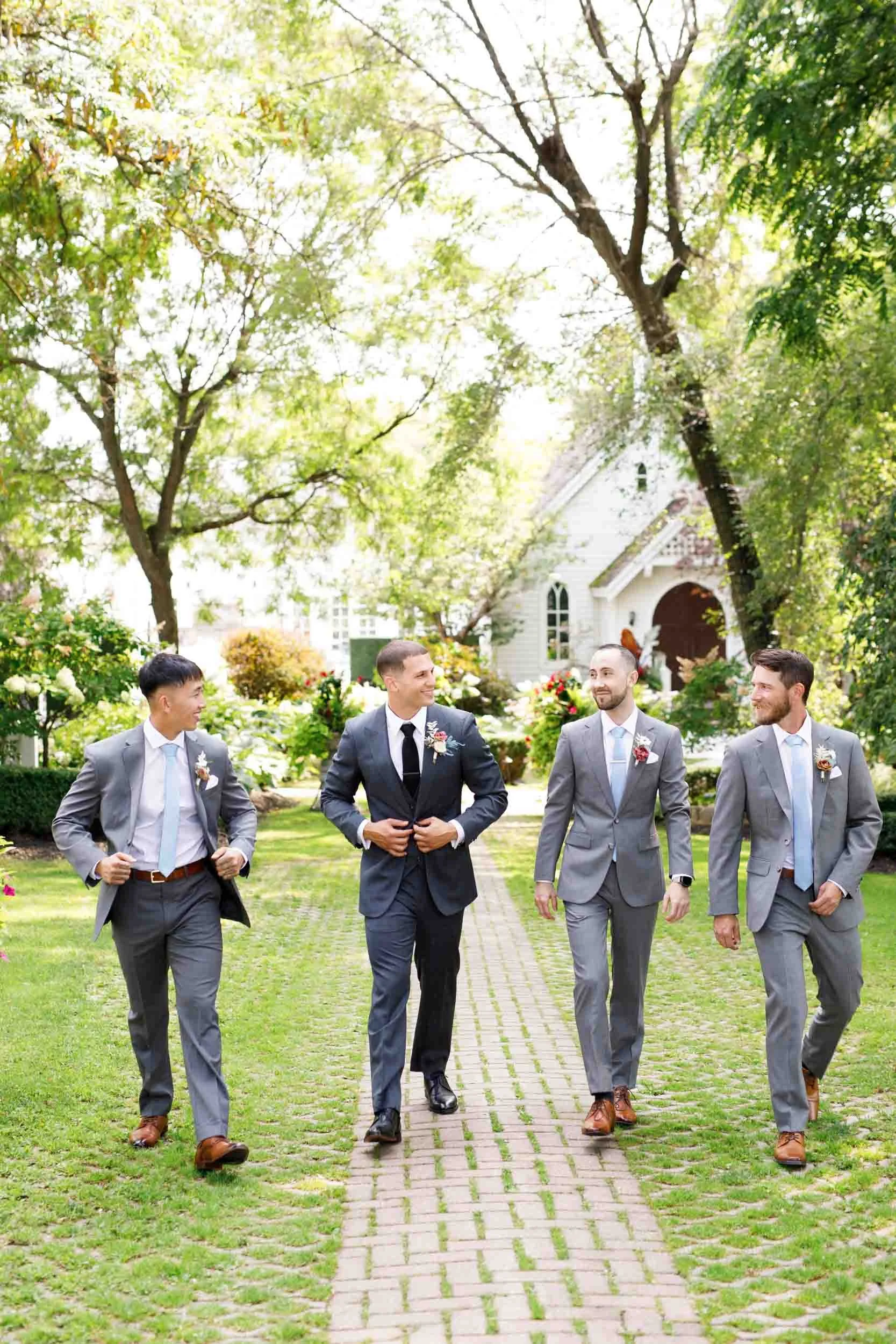 Groomsmen walking at The Doctor’s House in Kleinburg, Ontario wedding