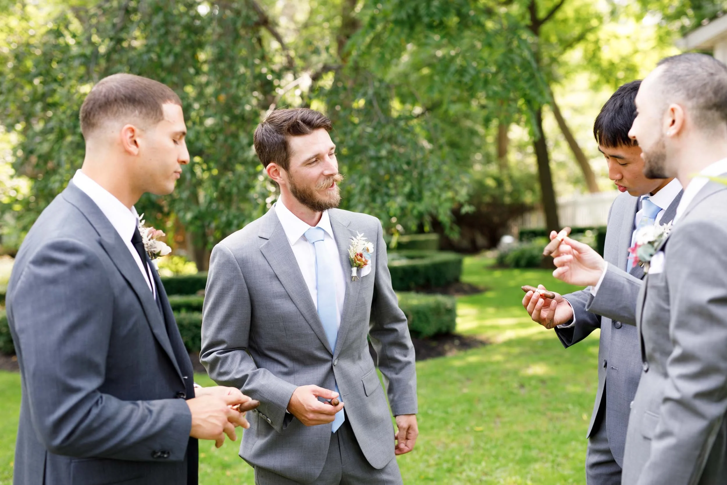 Groomsmen talking together at The Doctor’s House in Kleinburg