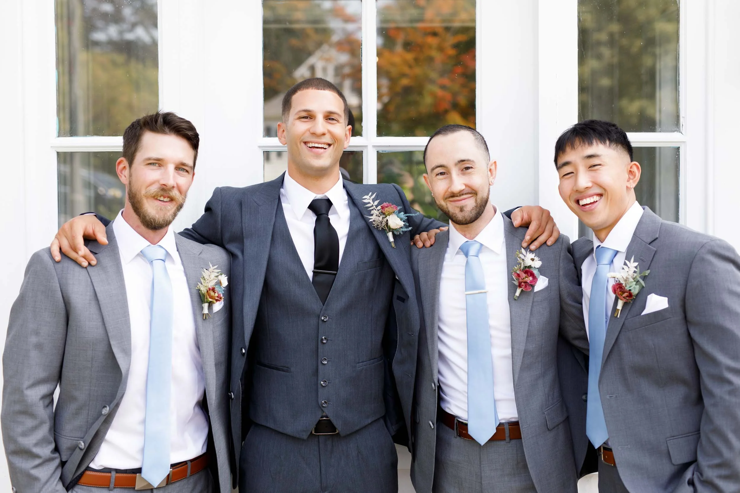 Groomsmen standing together at The Doctor’s House in Kleinburg, Ontario