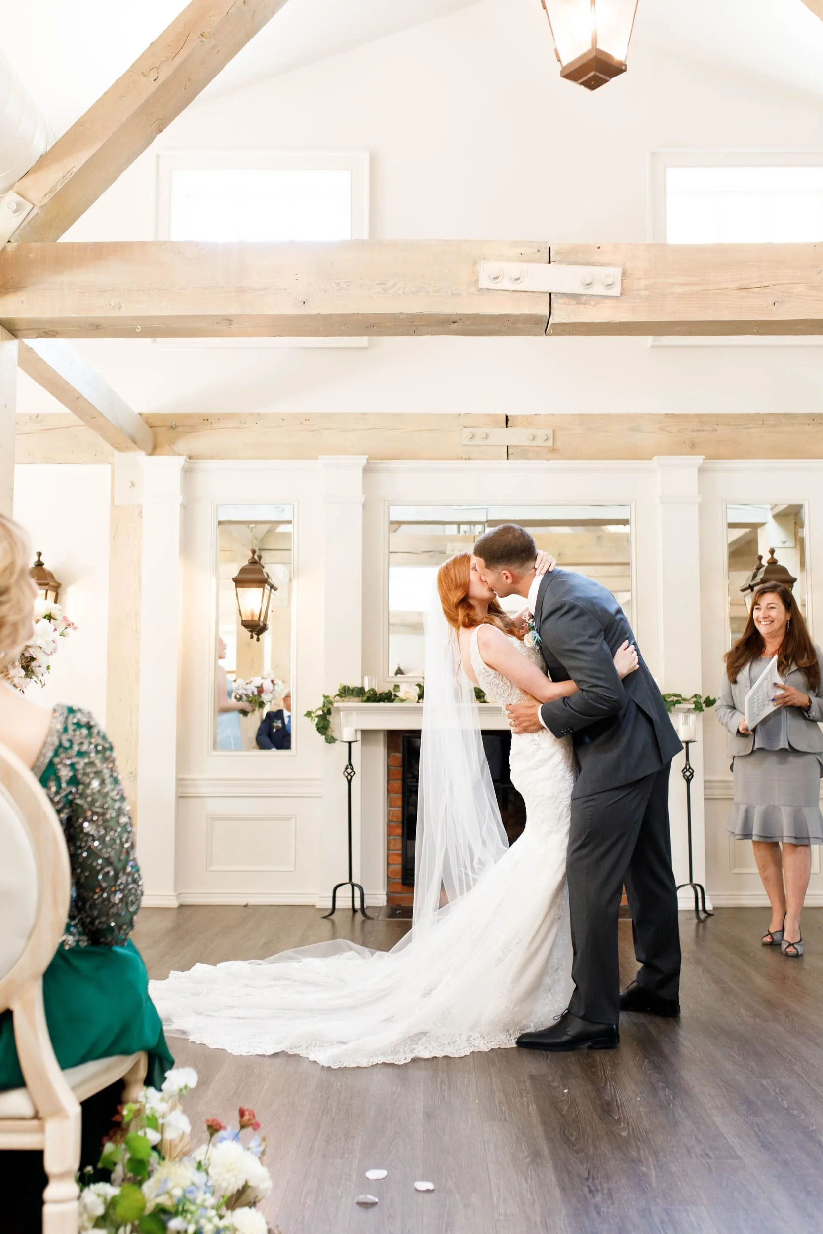 Bride and groom kissing at altar at The Doctor’s House in Kleinburg wedding