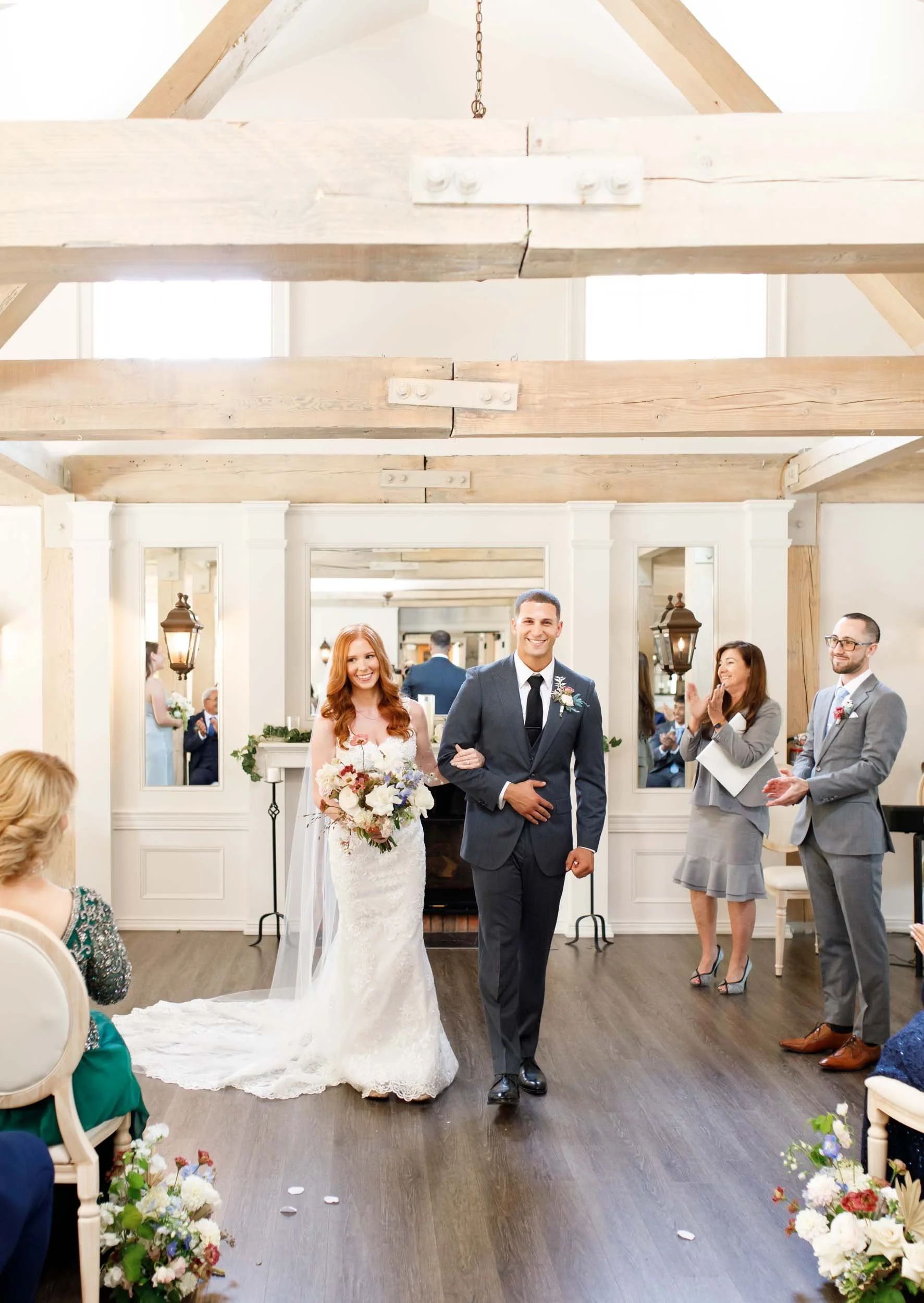 Bride and groom walking down the aisle at The Doctor’s House in Kleinburg