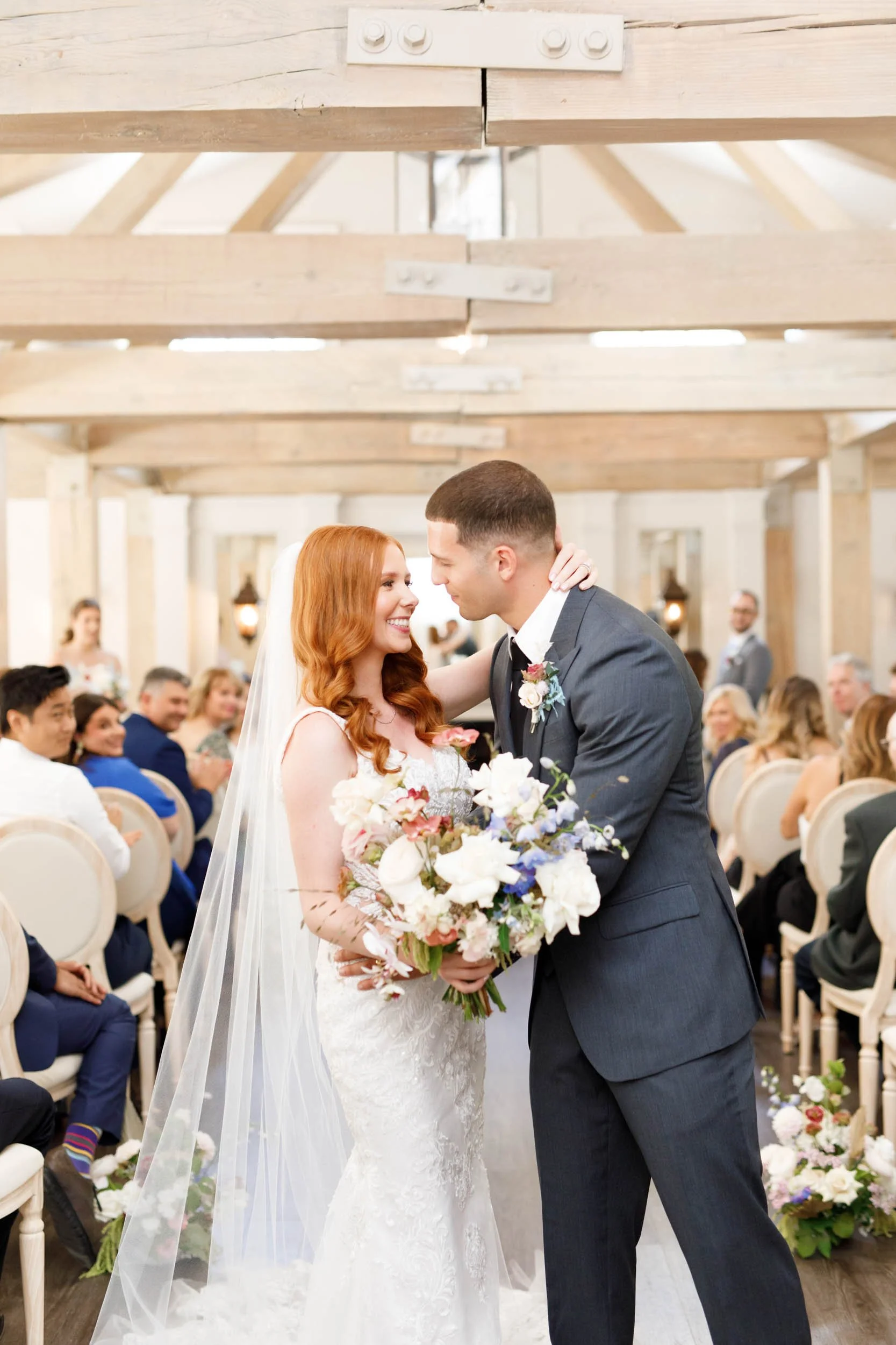 Newlyweds walking down the aisle at The Doctor’s House in Kleinburg, Ontario