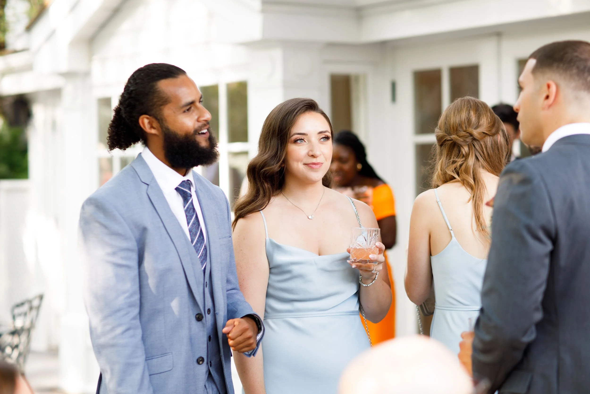 Wedding guests talking at The Doctor’s House in Kleinburg, Ontario