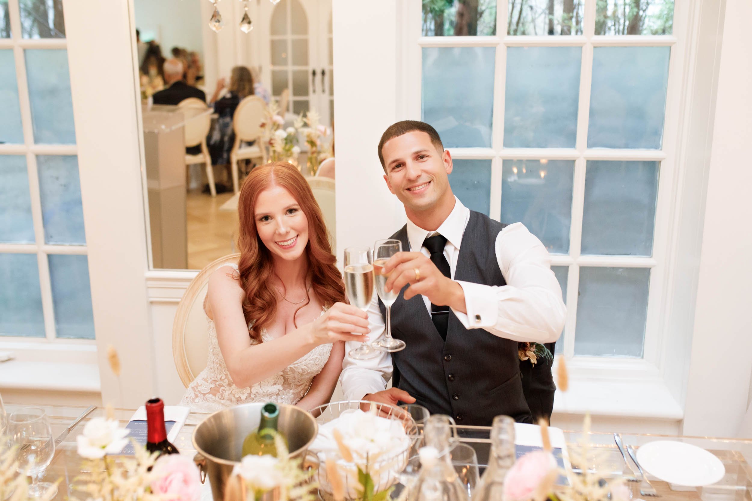 Bride and groom at head table at The Doctor’s House in Kleinburg wedding