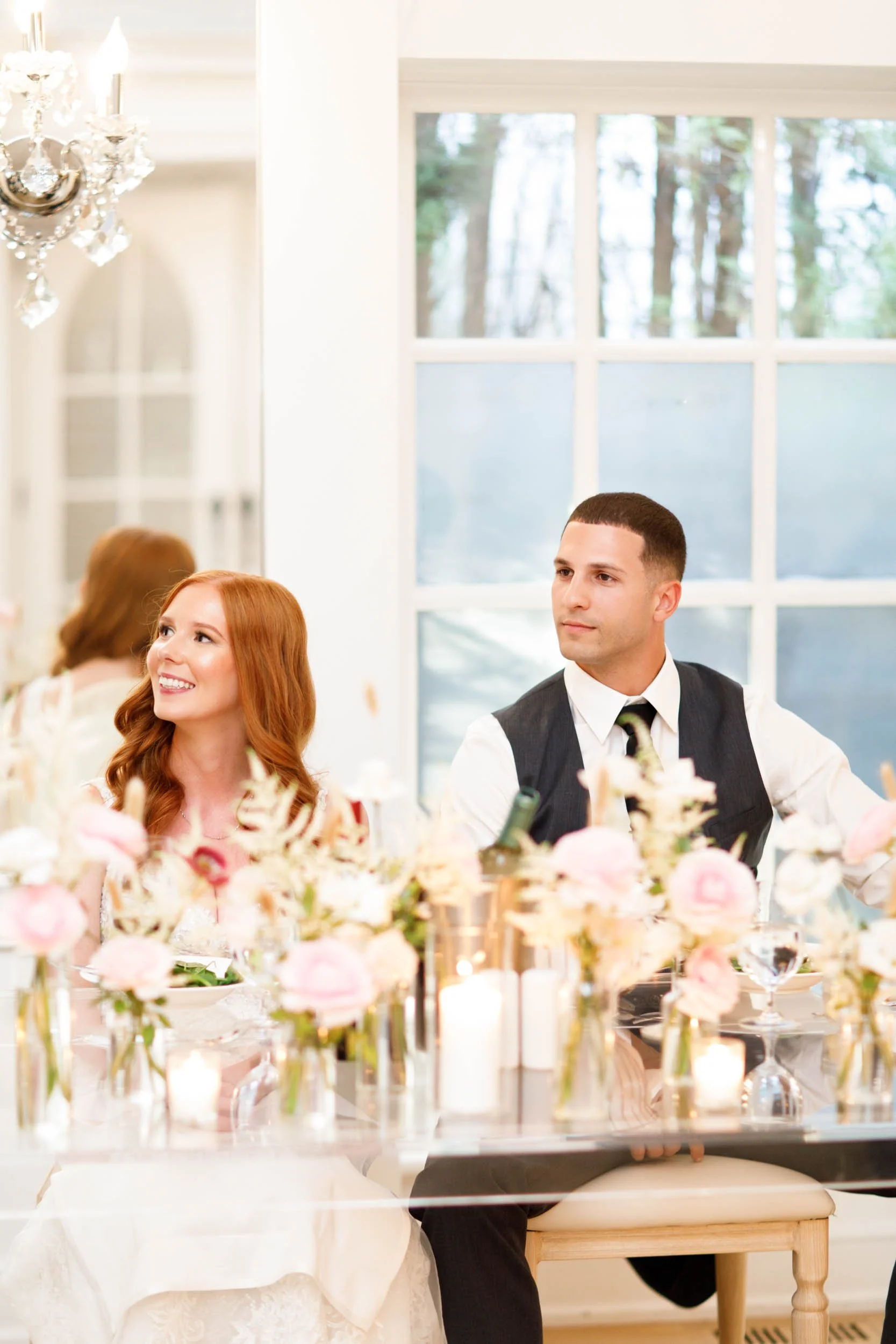 Bride and groom listening to speeches at The Doctor’s House in Kleinburg, Ontario