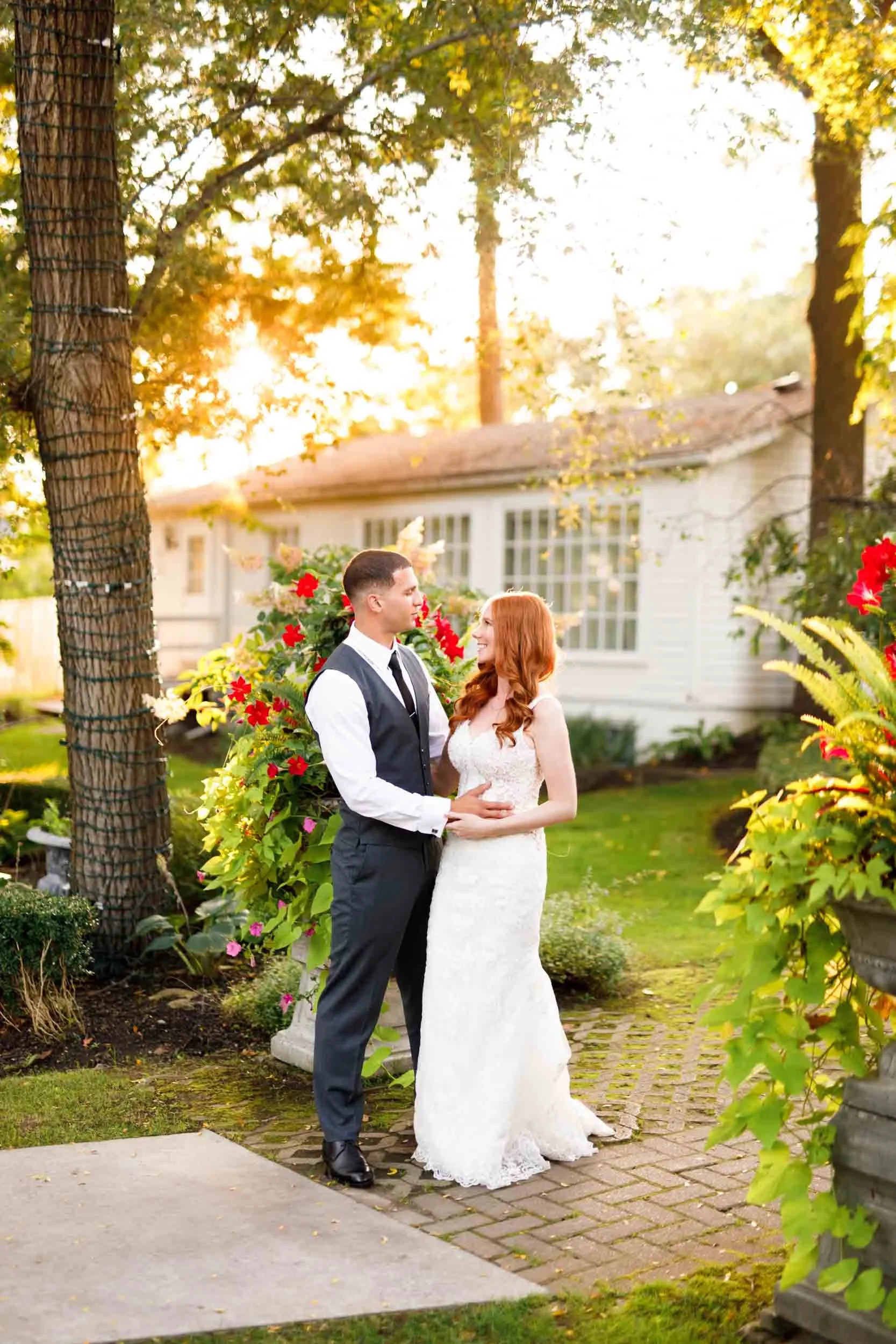 Bride and groom standing together at sunset at The Doctor’s House in Kleinburg