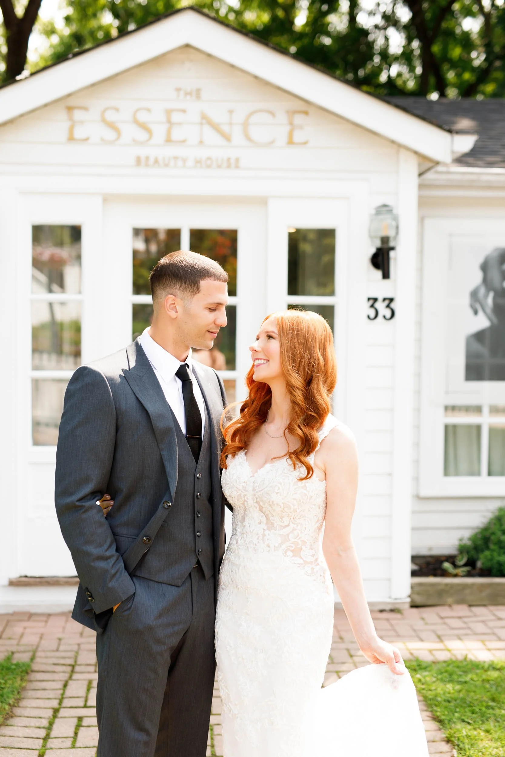 Bride and groom outside Essence wedding building at The Doctor’s House in Kleinburg
