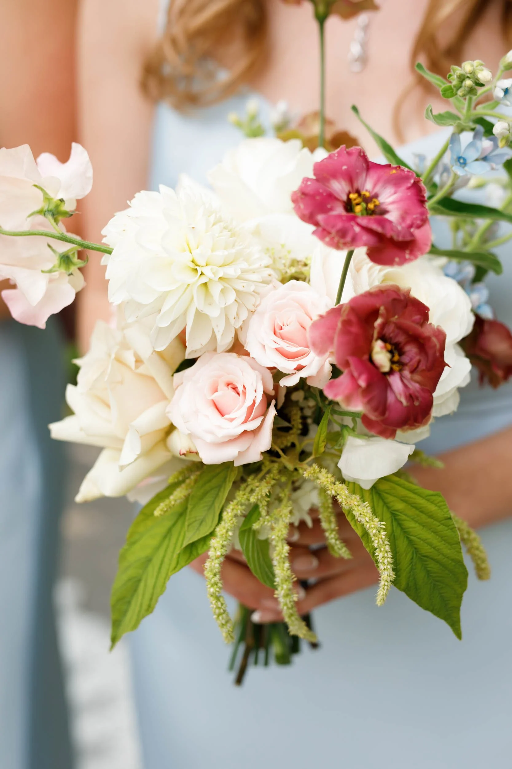 Bridesmaid holding wedding bouquet at The Doctor’s House in Kleinburg wedding