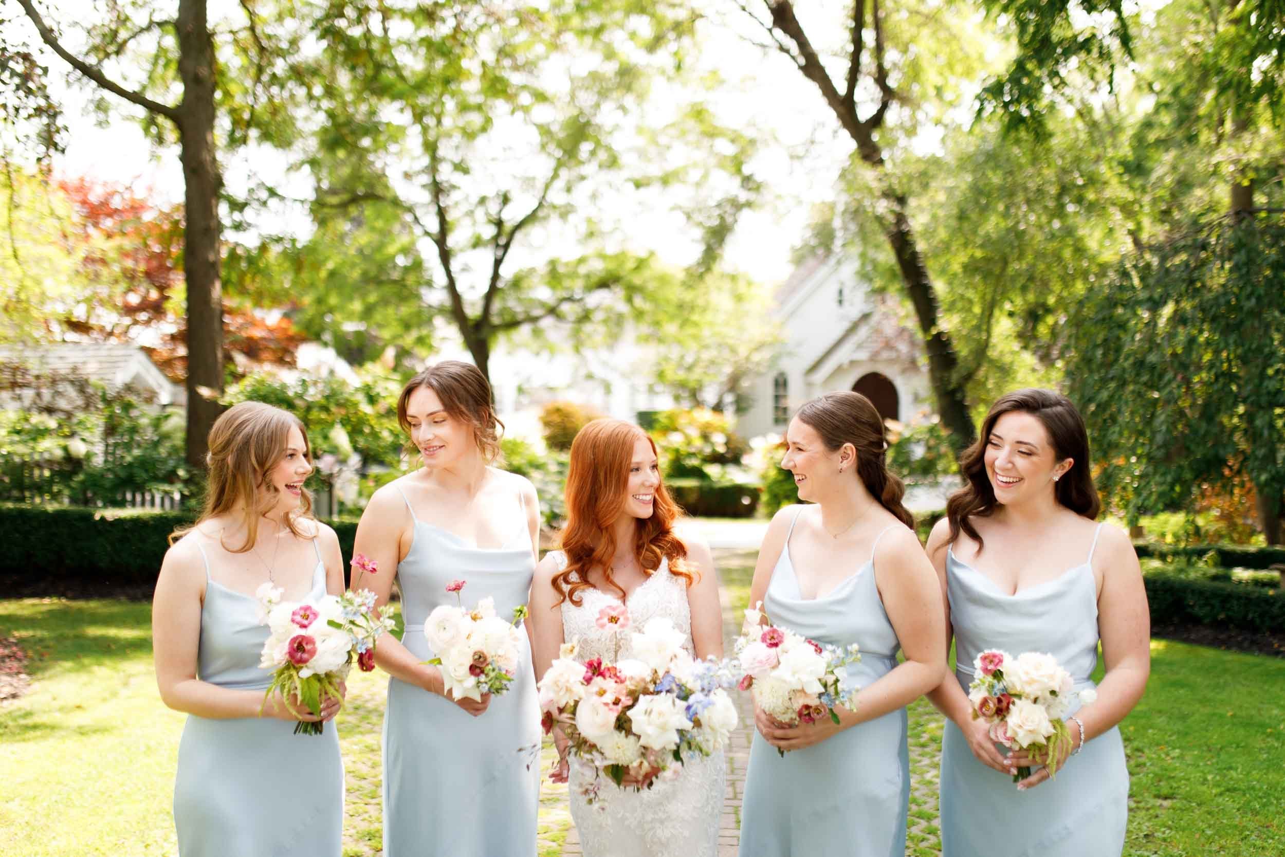 Bridesmaids standing together at The Doctor’s House in Kleinburg, Ontario wedding