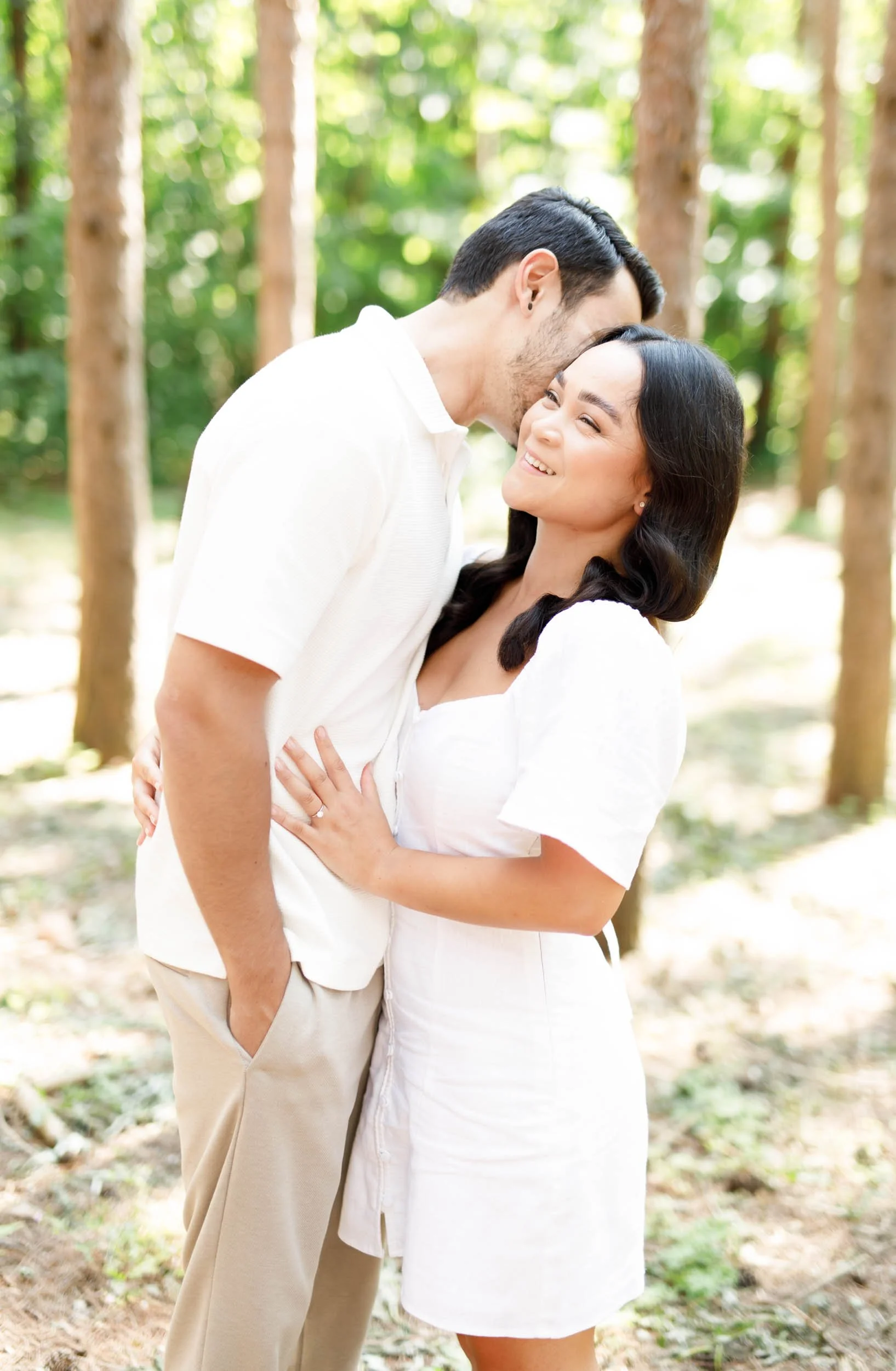 Couple standing close together during engagement photos at Kortright Centre for Conservation in Woodbridge, Ontario