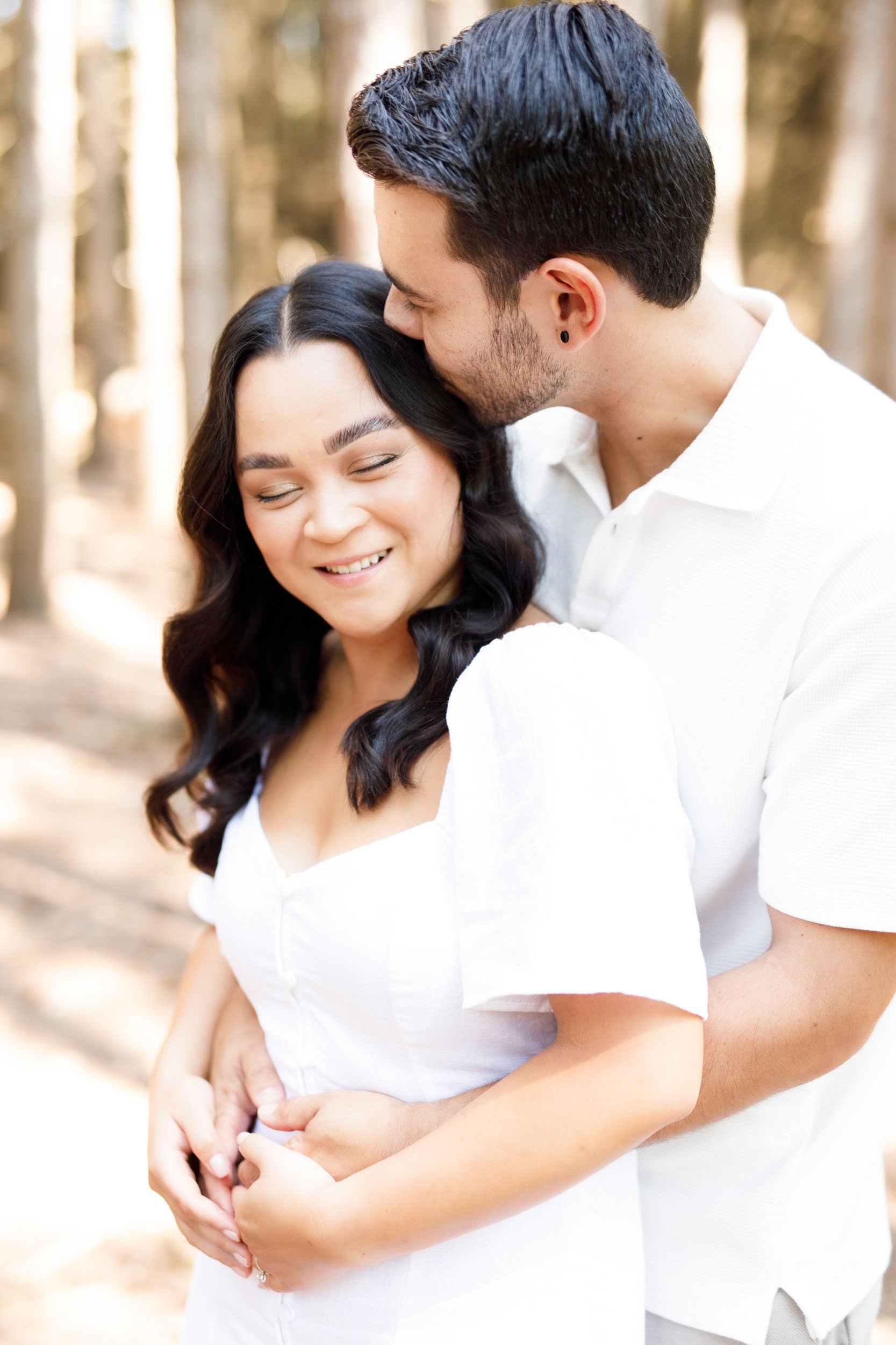 Close-up of couple hugging in the forest at Kortright Centre in Woodbridge, Ontario