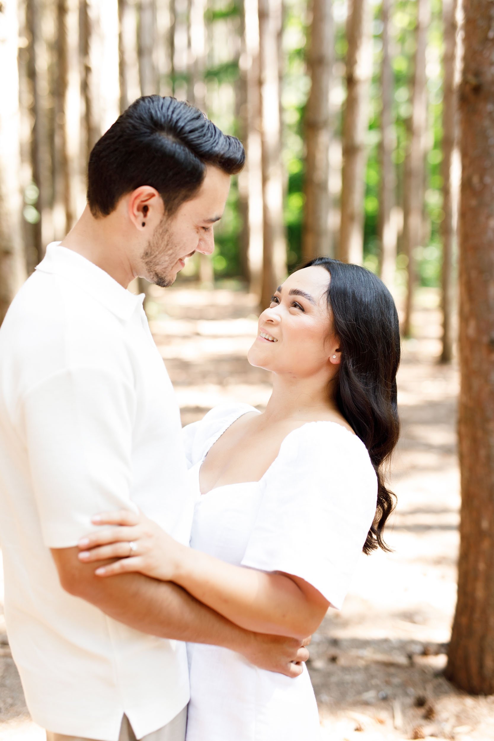Couple gazing at each other during engagement portraits at Kortright Centre for Conservation in Woodbridge, Ontario