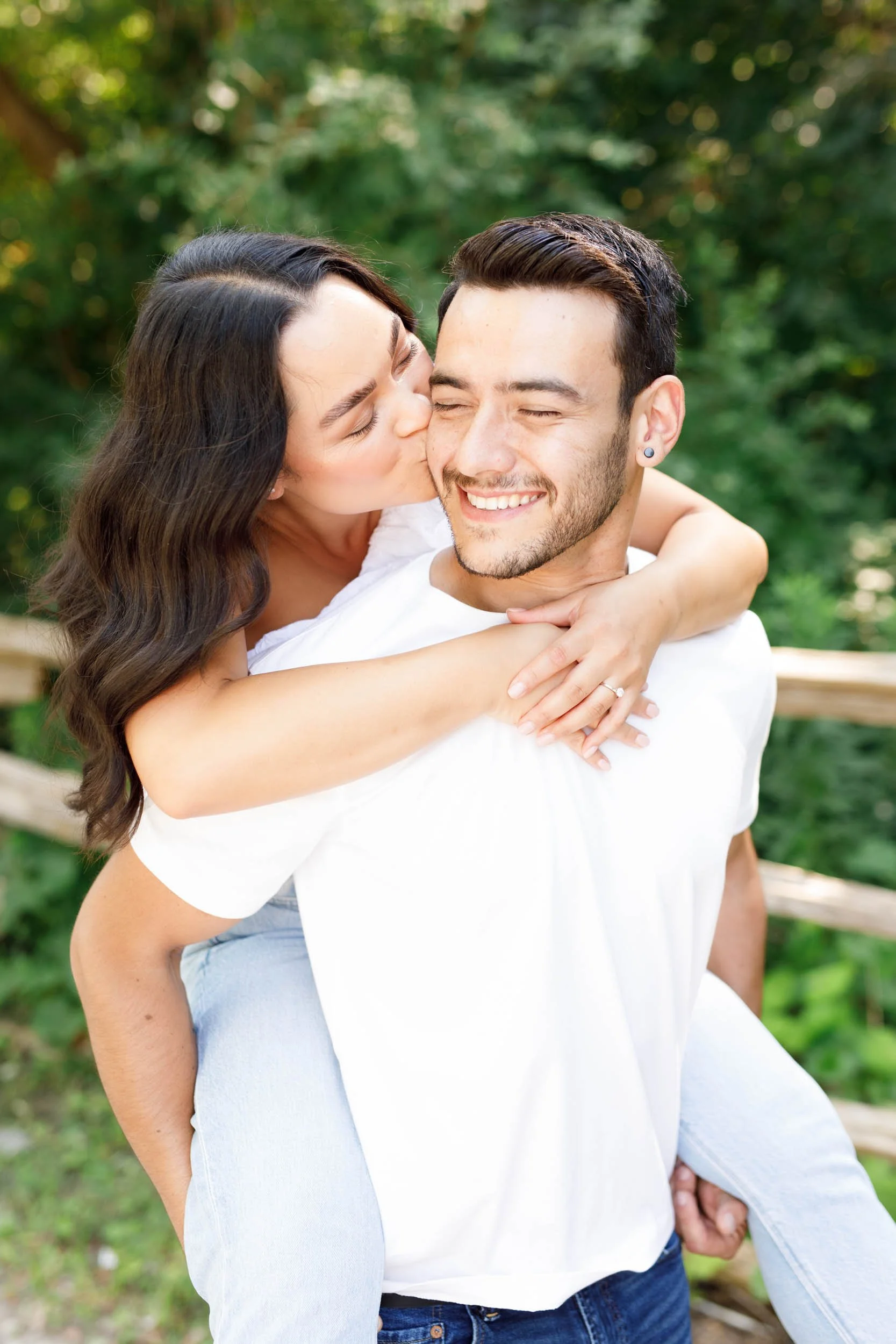 Close-up of bride hugging groom during Kortright Centre engagement photos in Woodbridge, Ontario