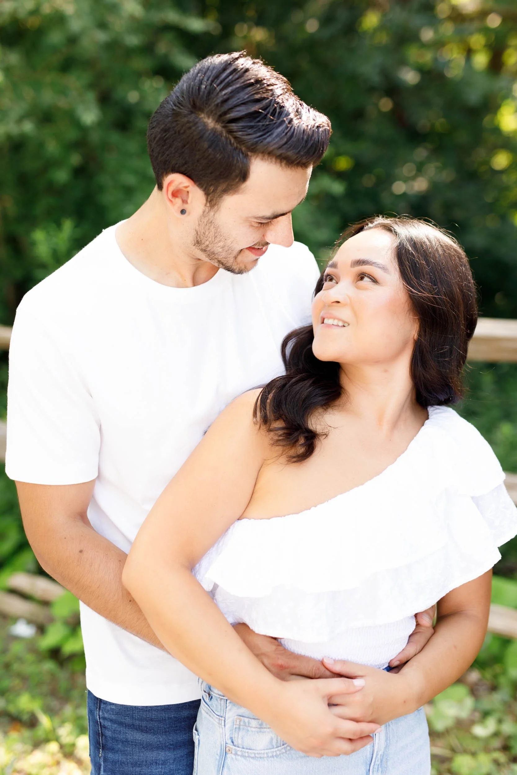 Couple standing close and smiling during their Kortright Centre engagement in Woodbridge, Ontario