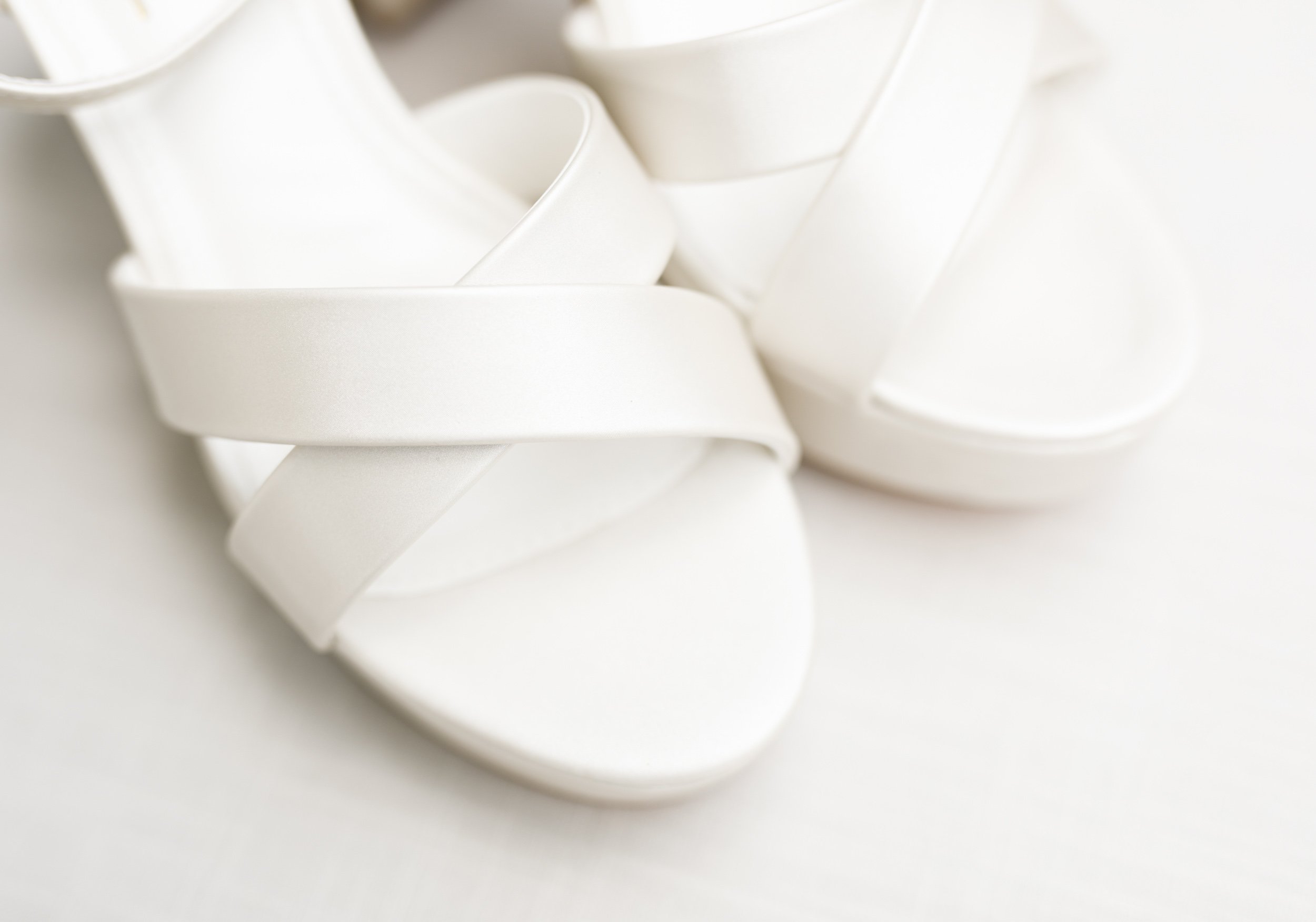 Bride’s white wedding sandals photographed for a Cambium Farms wedding in Alton, Ontario