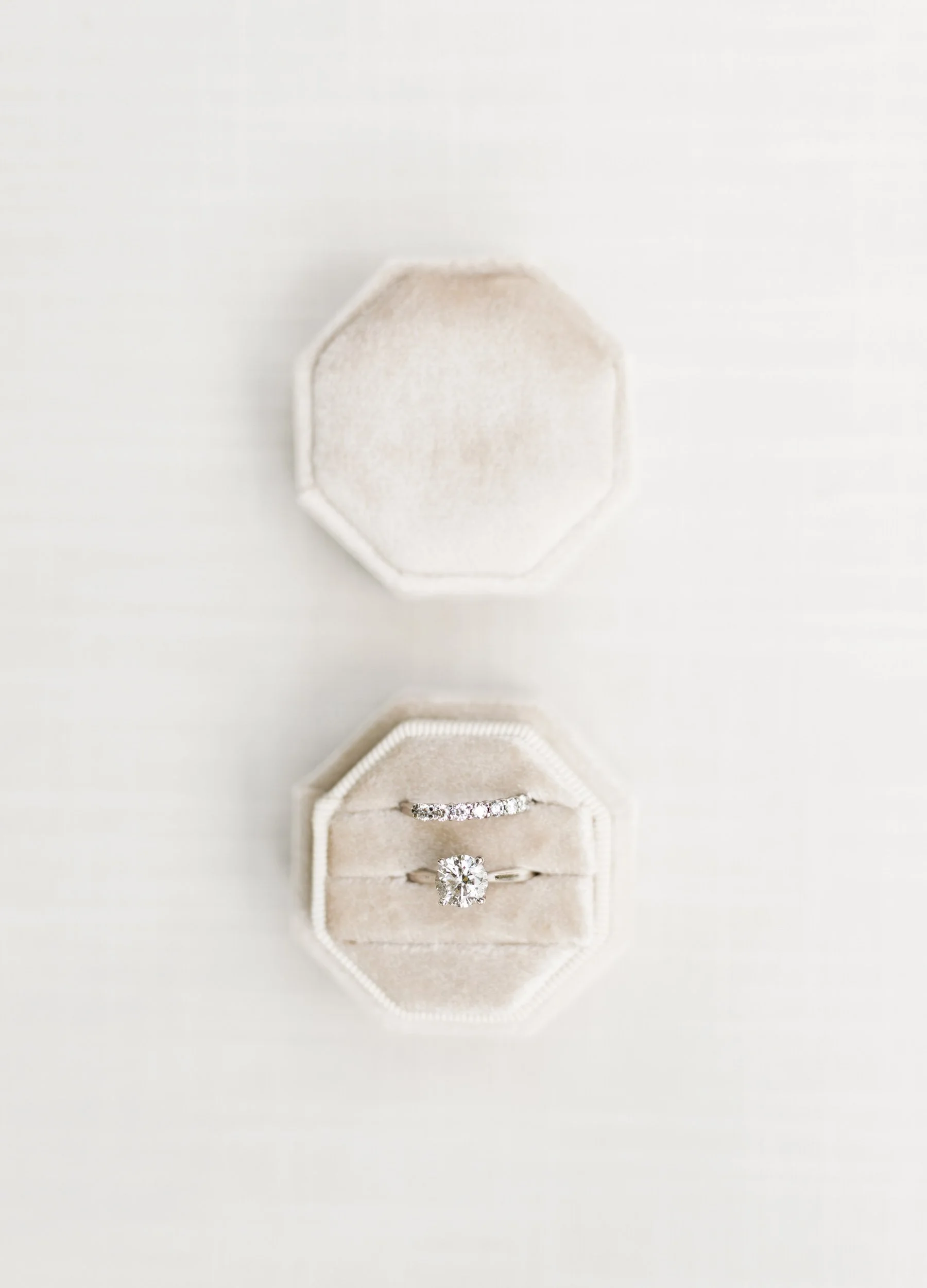Bride’s engagement ring and wedding band in velvet ring box at a Cambium Farms wedding in Alton, Ontario