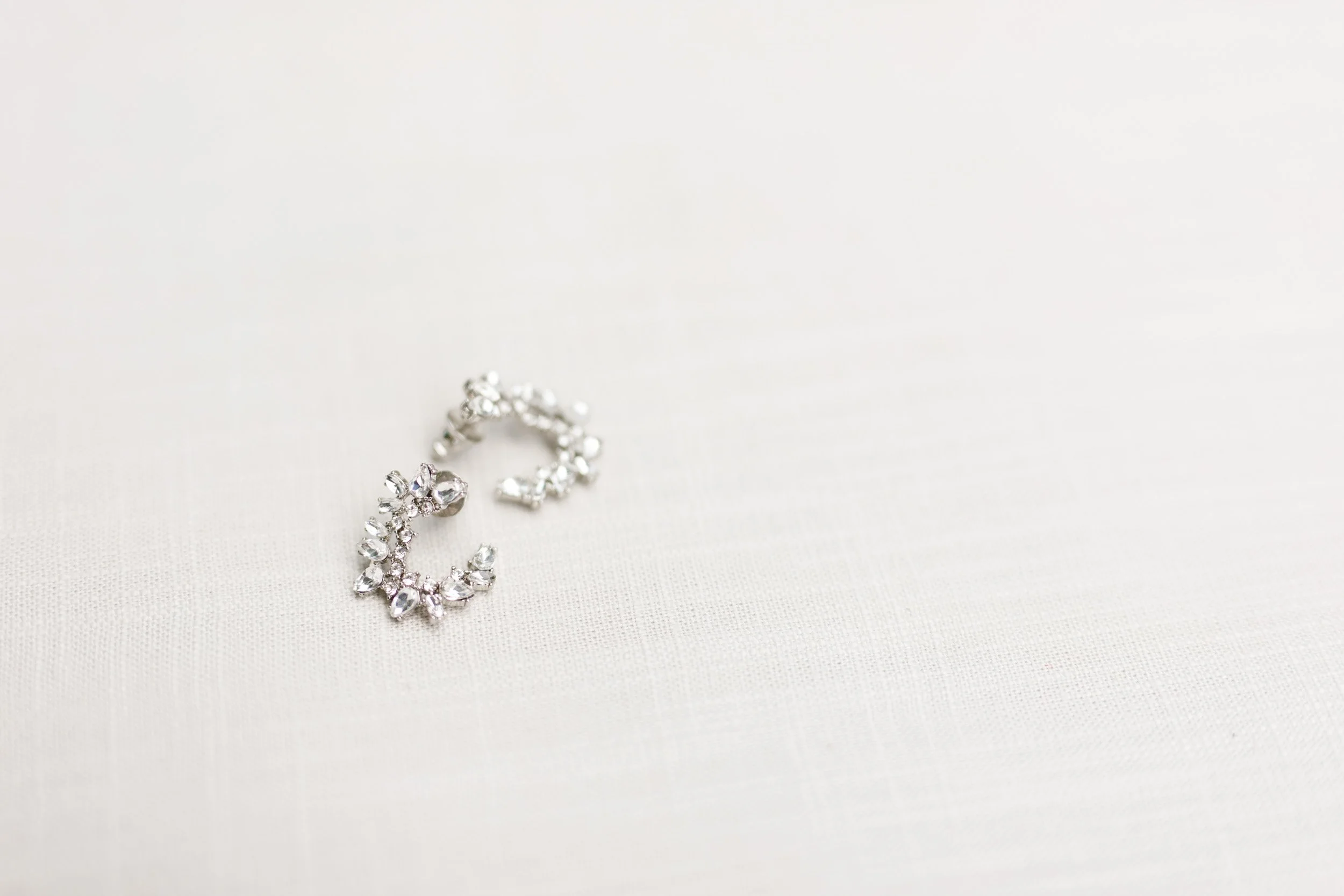 Close-up of bride’s diamond bracelet photographed for a Cambium Farms wedding in Alton, Ontario