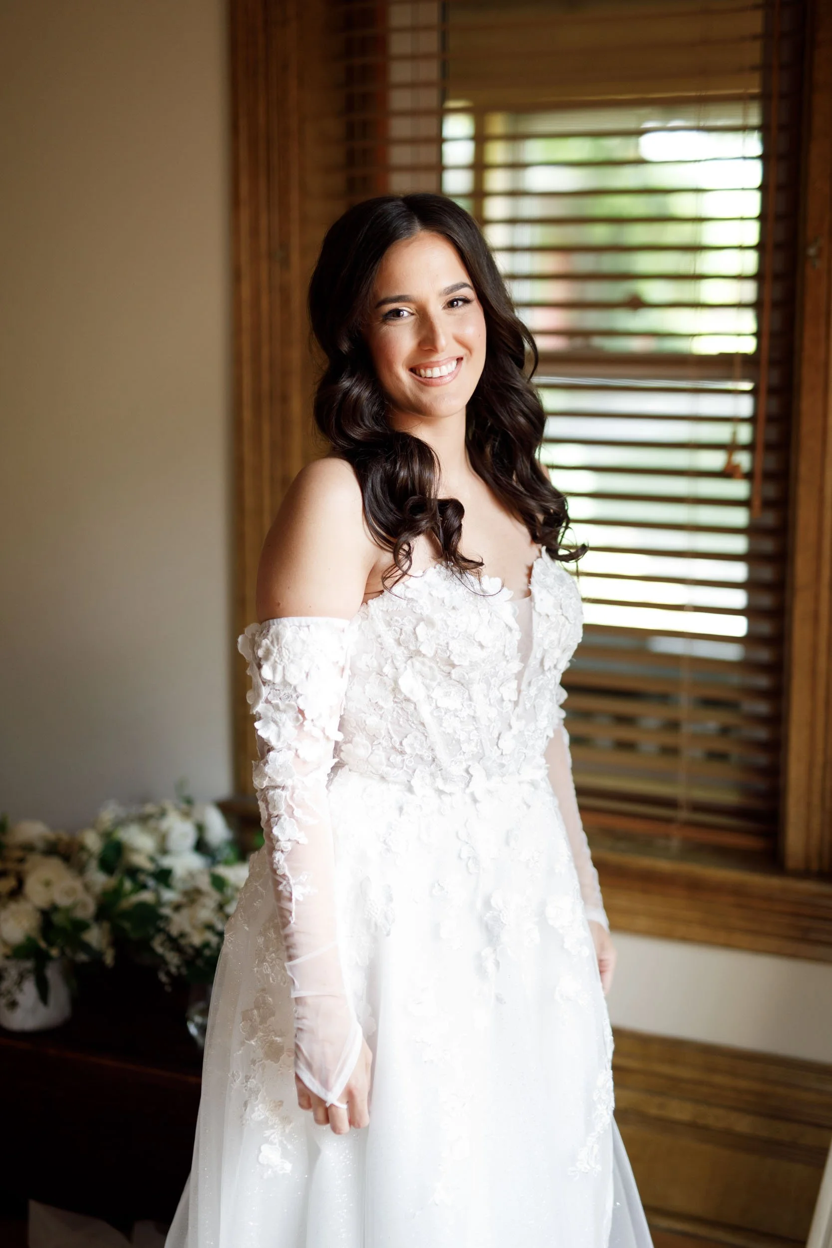 Bride in lace wedding gown during bridal portraits at a Cambium Farms wedding in Alton, Ontario