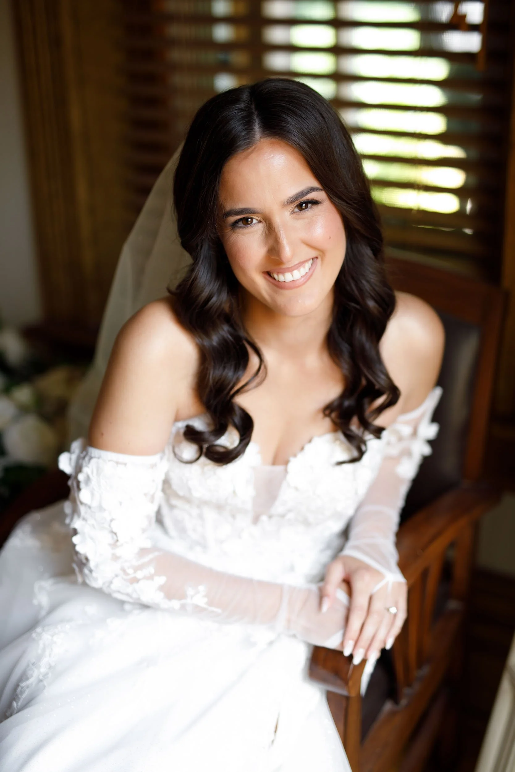 Bride smiling in her lace wedding dress during bridal prep at a Cambium Farms wedding in Alton, Ontario