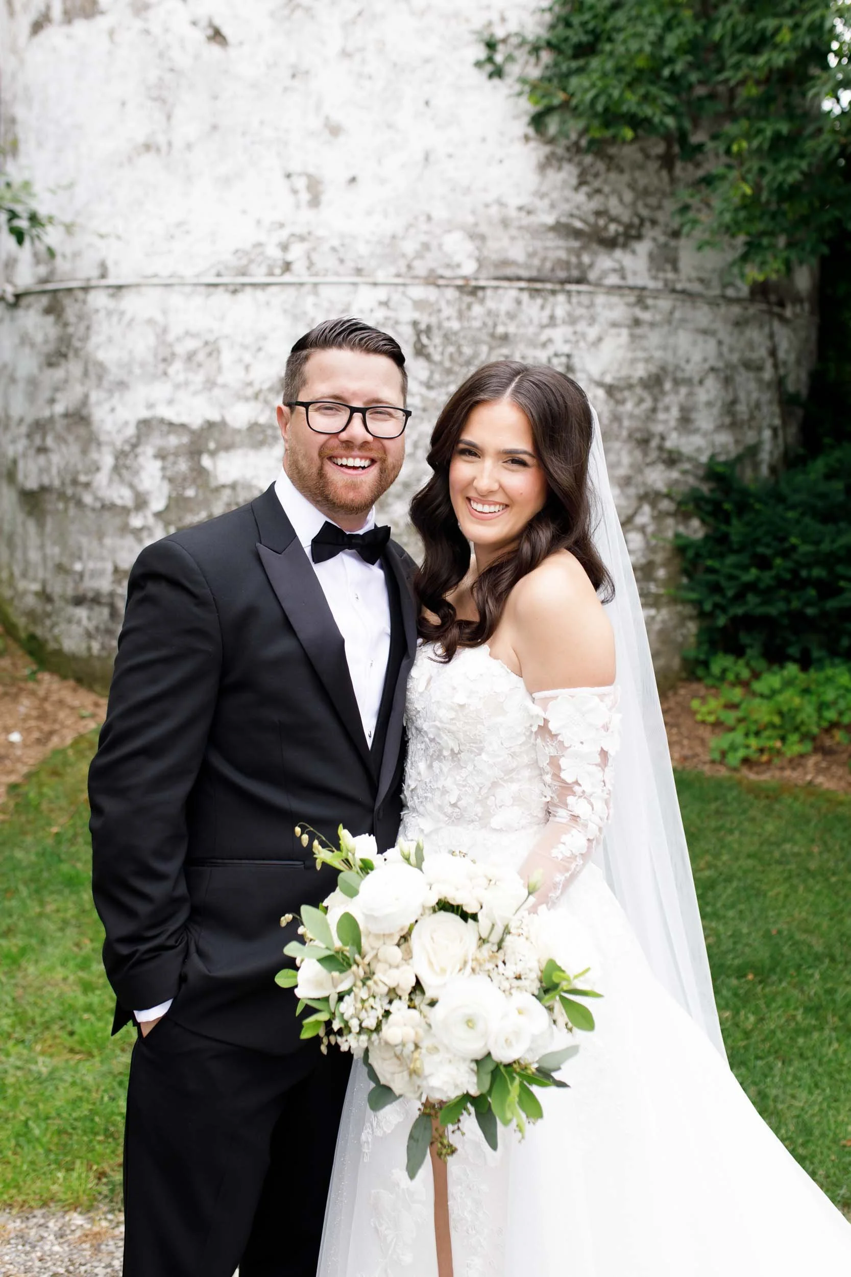 Bride and groom smiling together after their first look at a Cambium Farms wedding in Alton, Ontario
