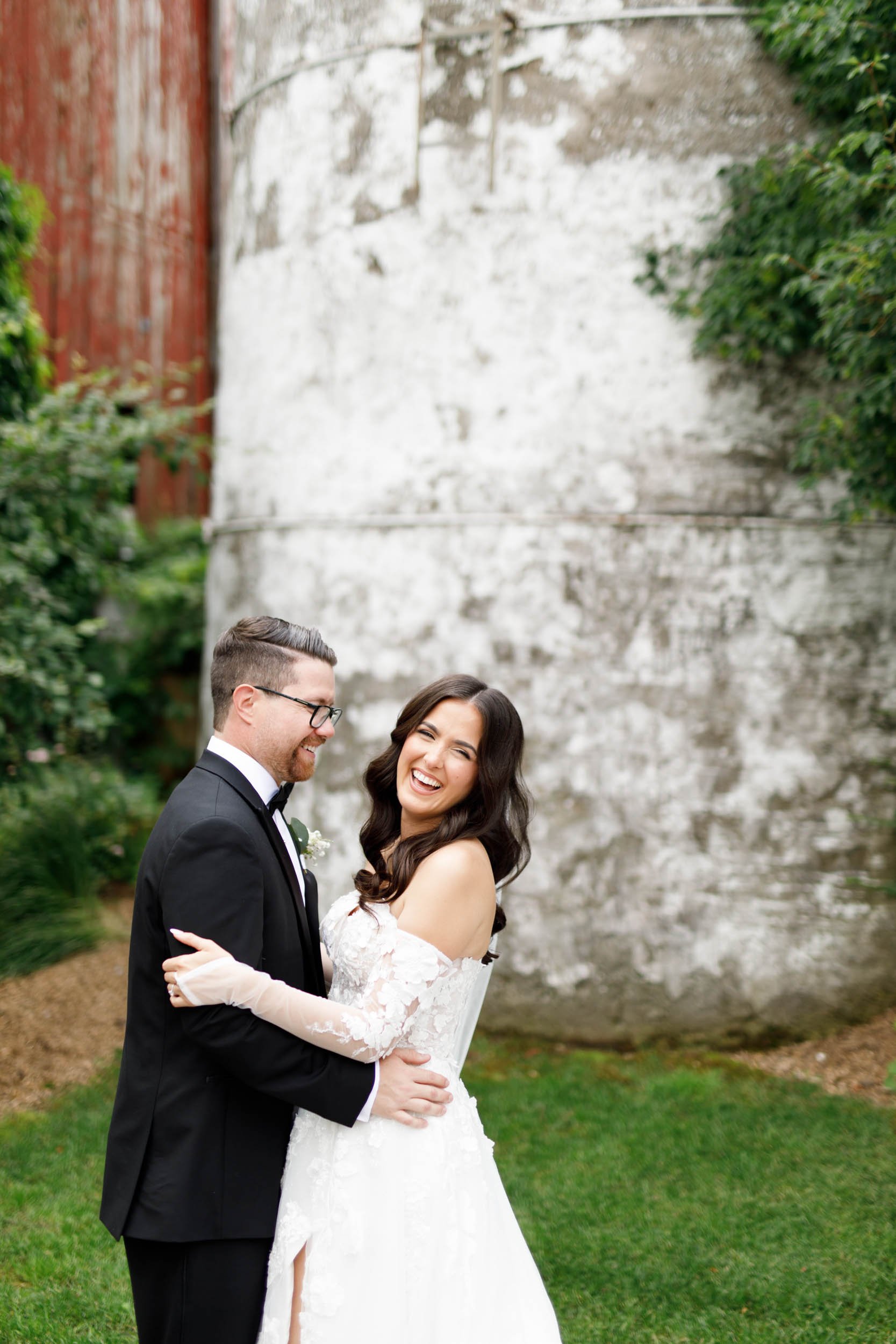 Bride and groom standing together during romantic wedding portraits at Cambium Farms in Alton, Ontario