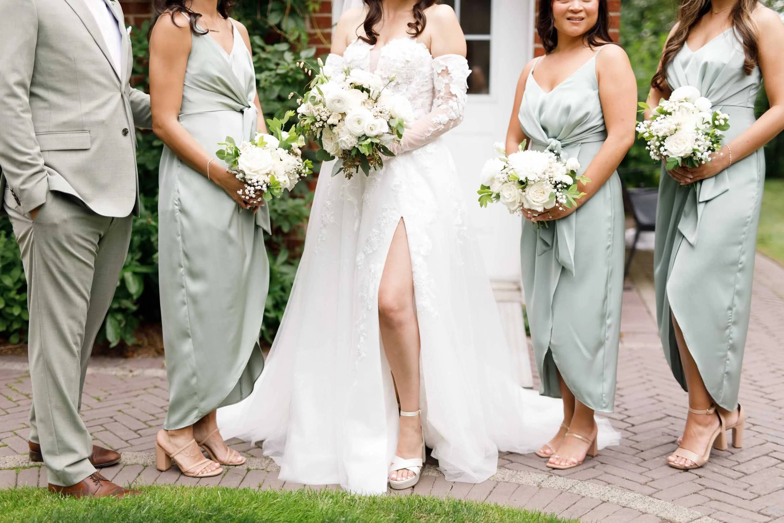 Close-up of bridesmaids dresses and bouquets at a Cambium Farms wedding in Alton, Ontario