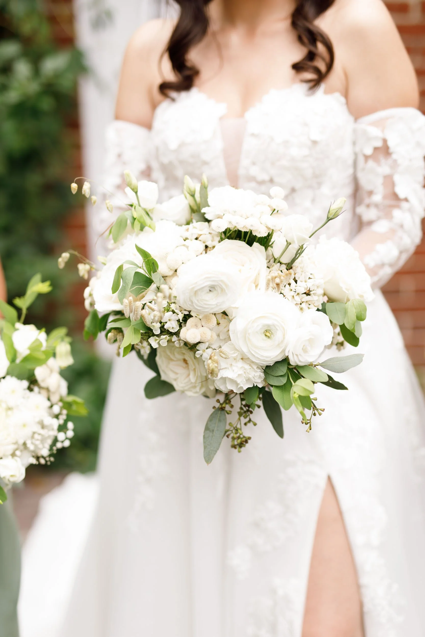 Bride holding a white floral bouquet during a Cambium Farms wedding in Alton, Ontario