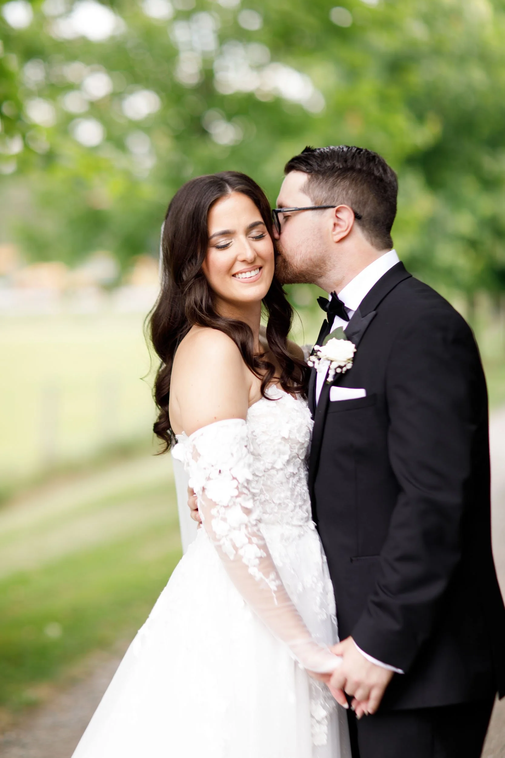 Bride and groom sharing a quiet moment on the Cambium Farms driveway in Alton, Ontario