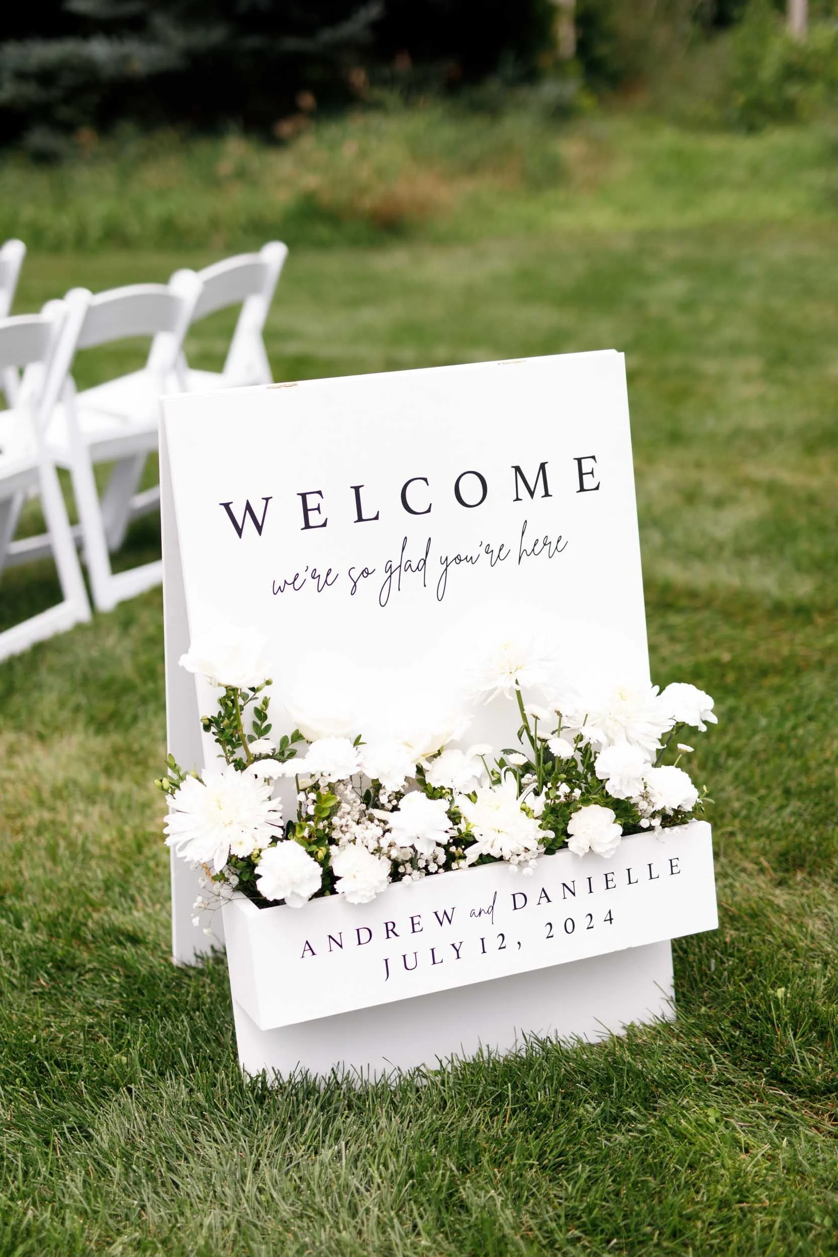 Welcome sign for outdoor wedding ceremony at Cambium Farms in Alton, Ontario
