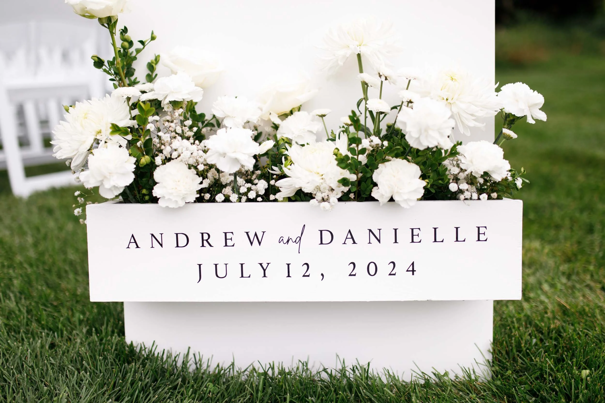Personalized wedding ceremony sign with couple’s names at a Cambium Farms wedding in Alton, Ontario