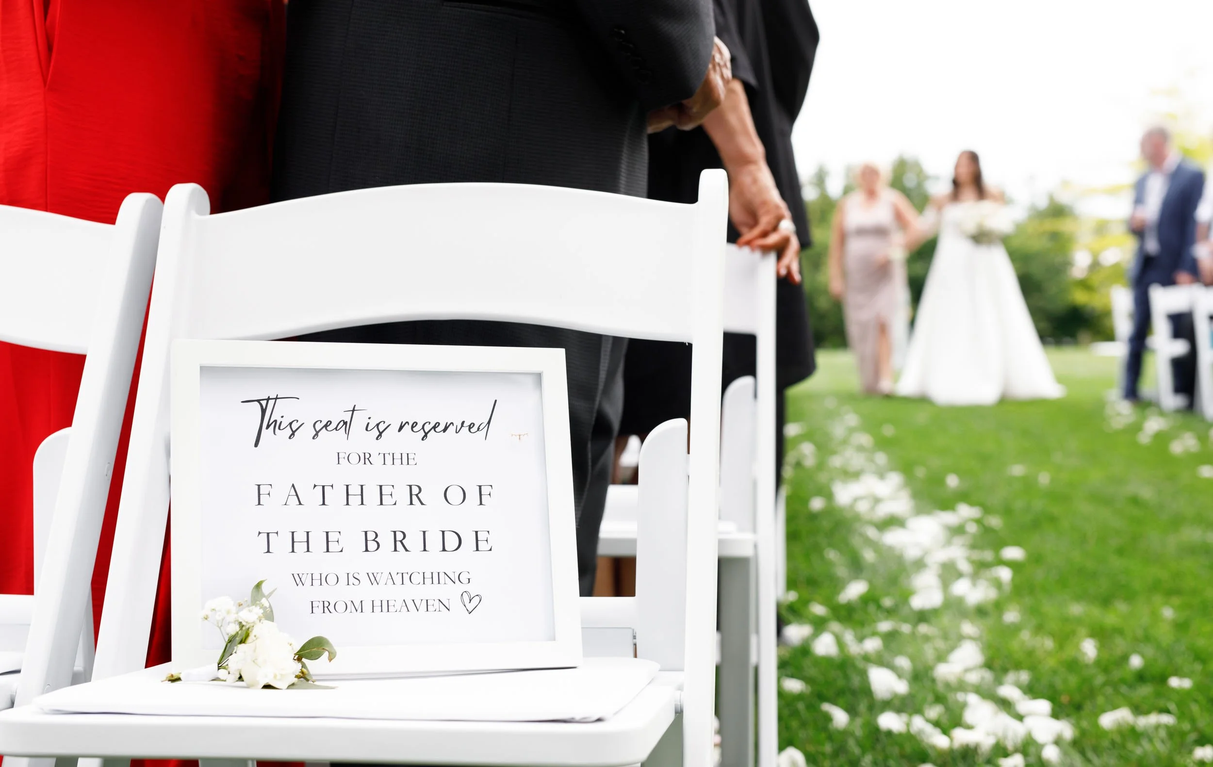 Father of the bride memorial at wedding ceremony chairs at a Cambium Farms wedding in Alton, Ontario