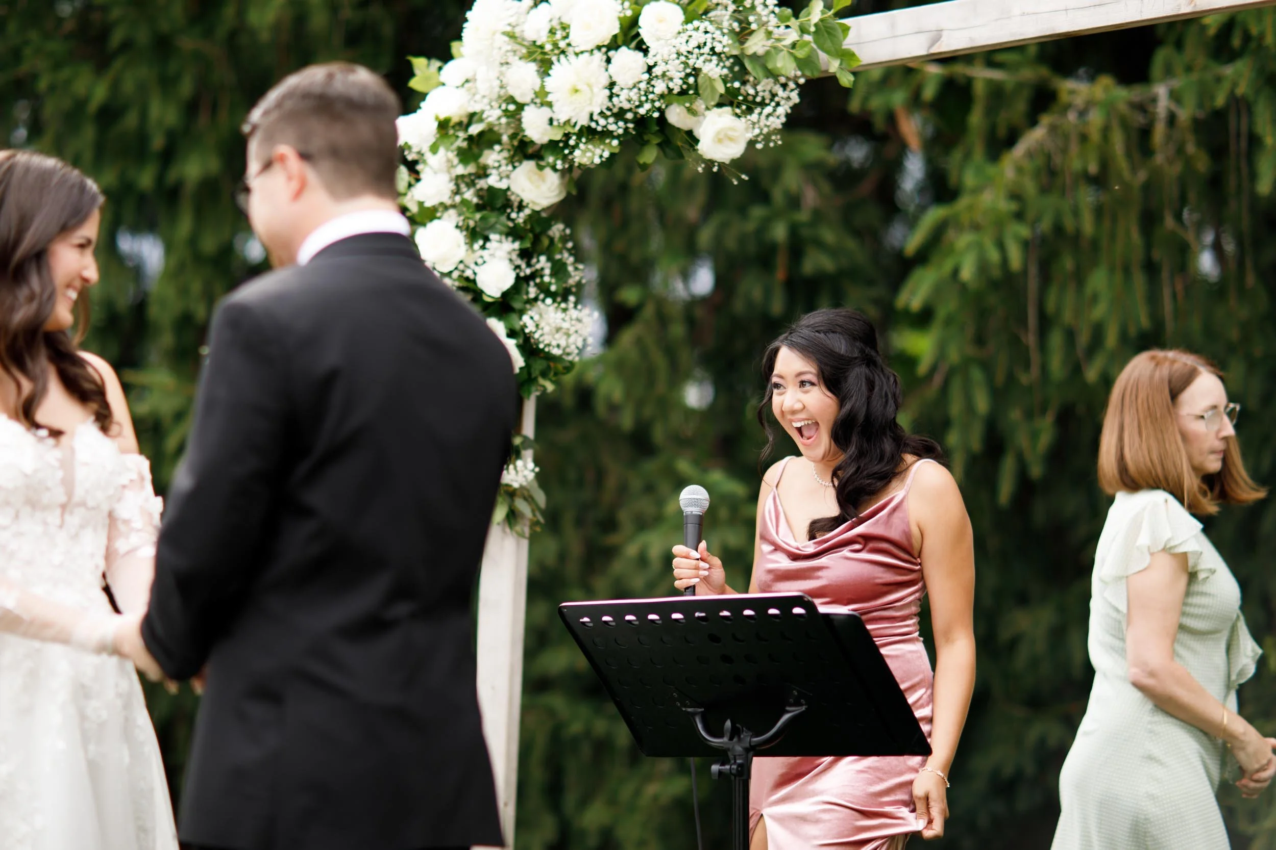 Officiant speaking during wedding ceremony at Cambium Farms in Alton, Ontario