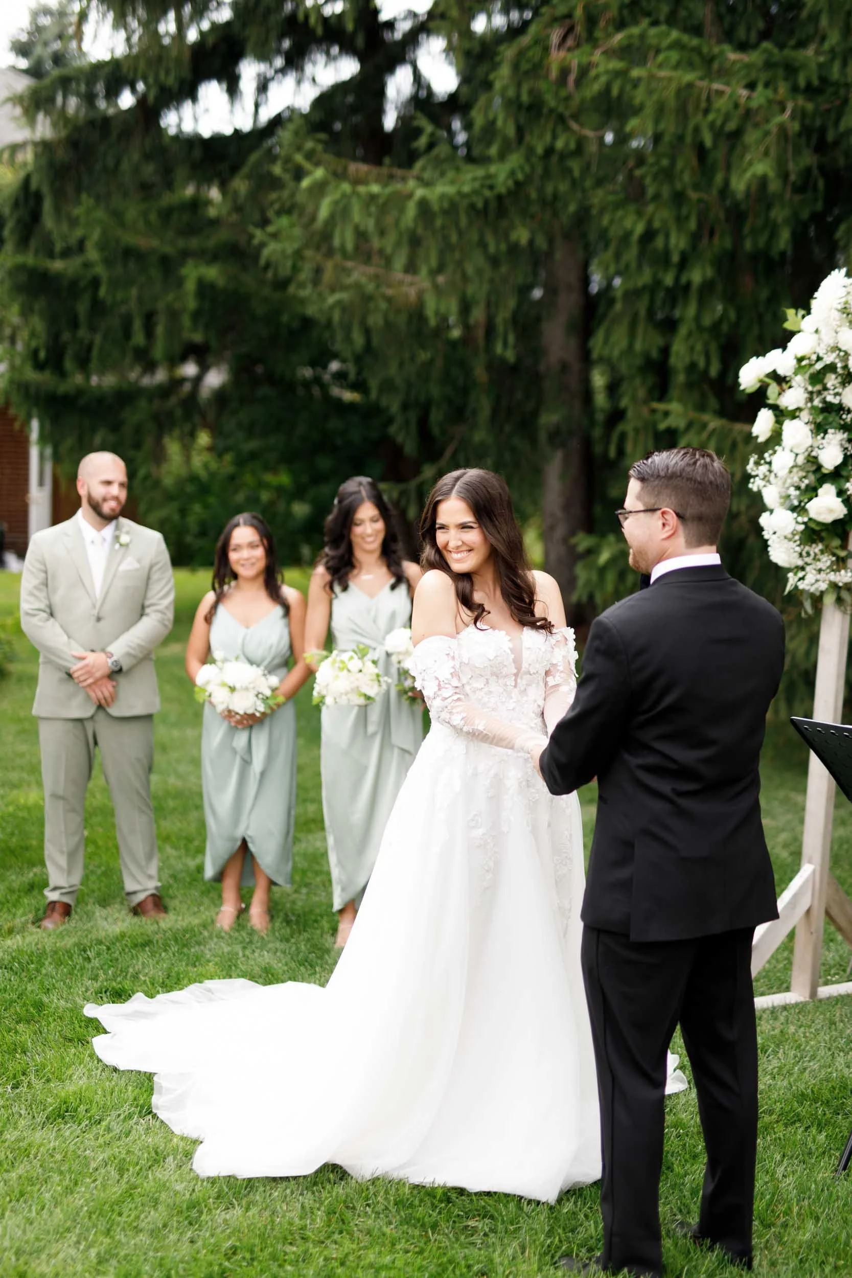 Bride and groom with wedding party during their Cambium Farms ceremony in Alton, Ontario