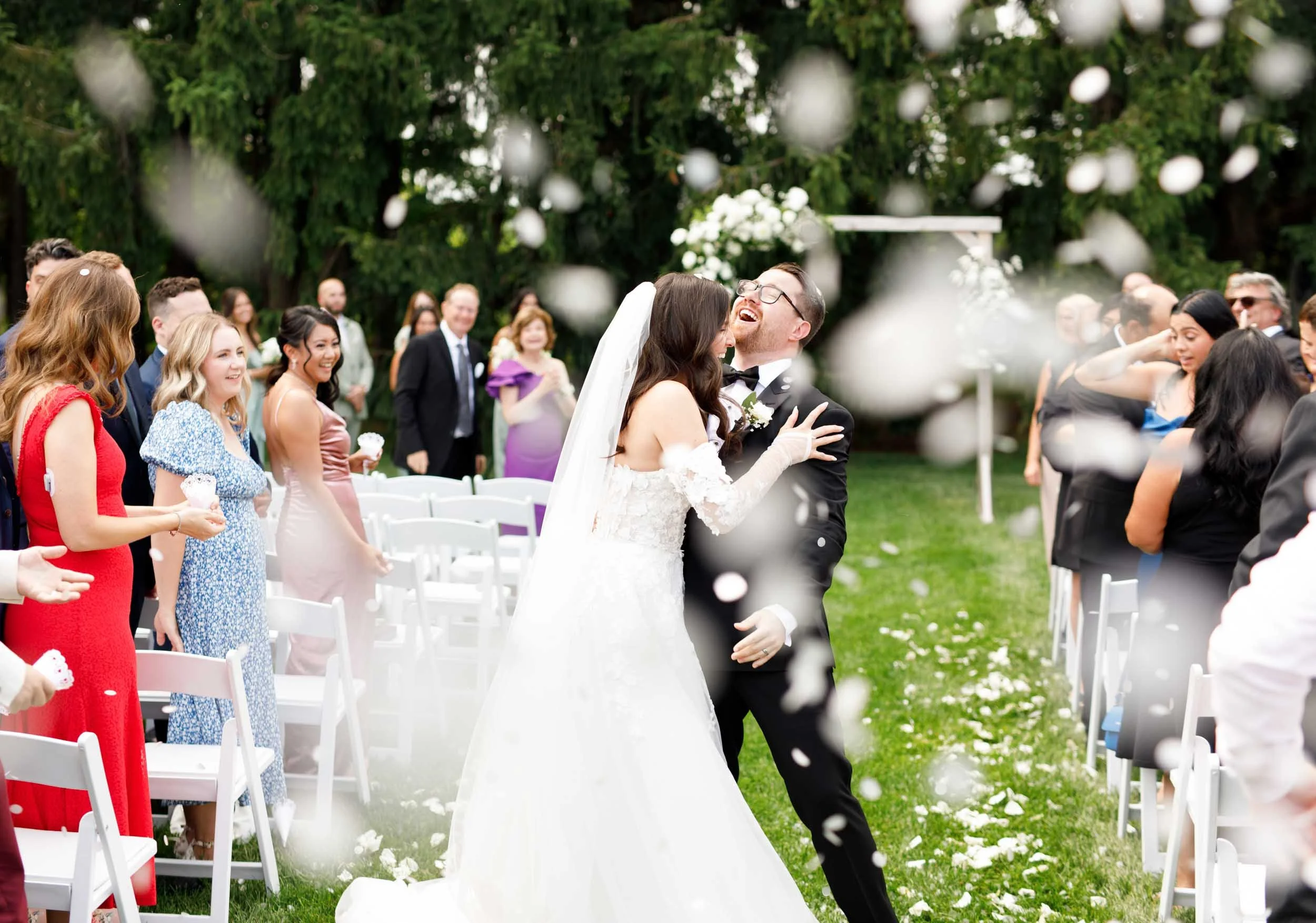 Bride twirling in her wedding dress during the confetti exit at Cambium Farms in Alton, Ontario