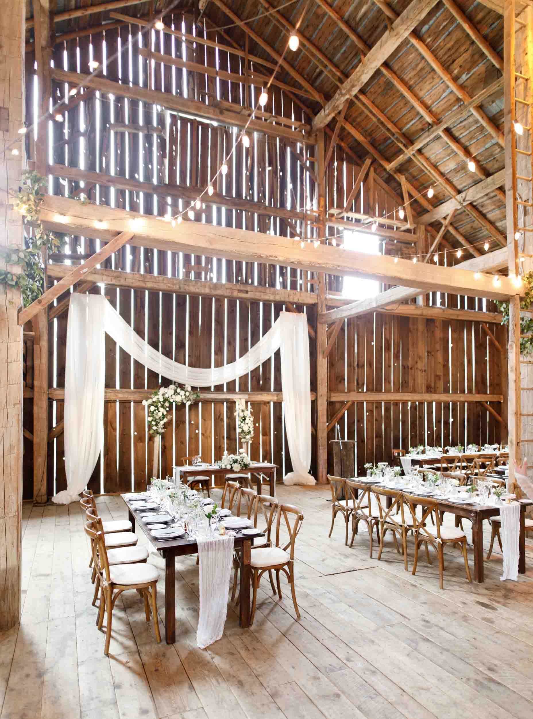 Interior of the Cambium Farms barn set up for wedding reception in Alton, Ontario