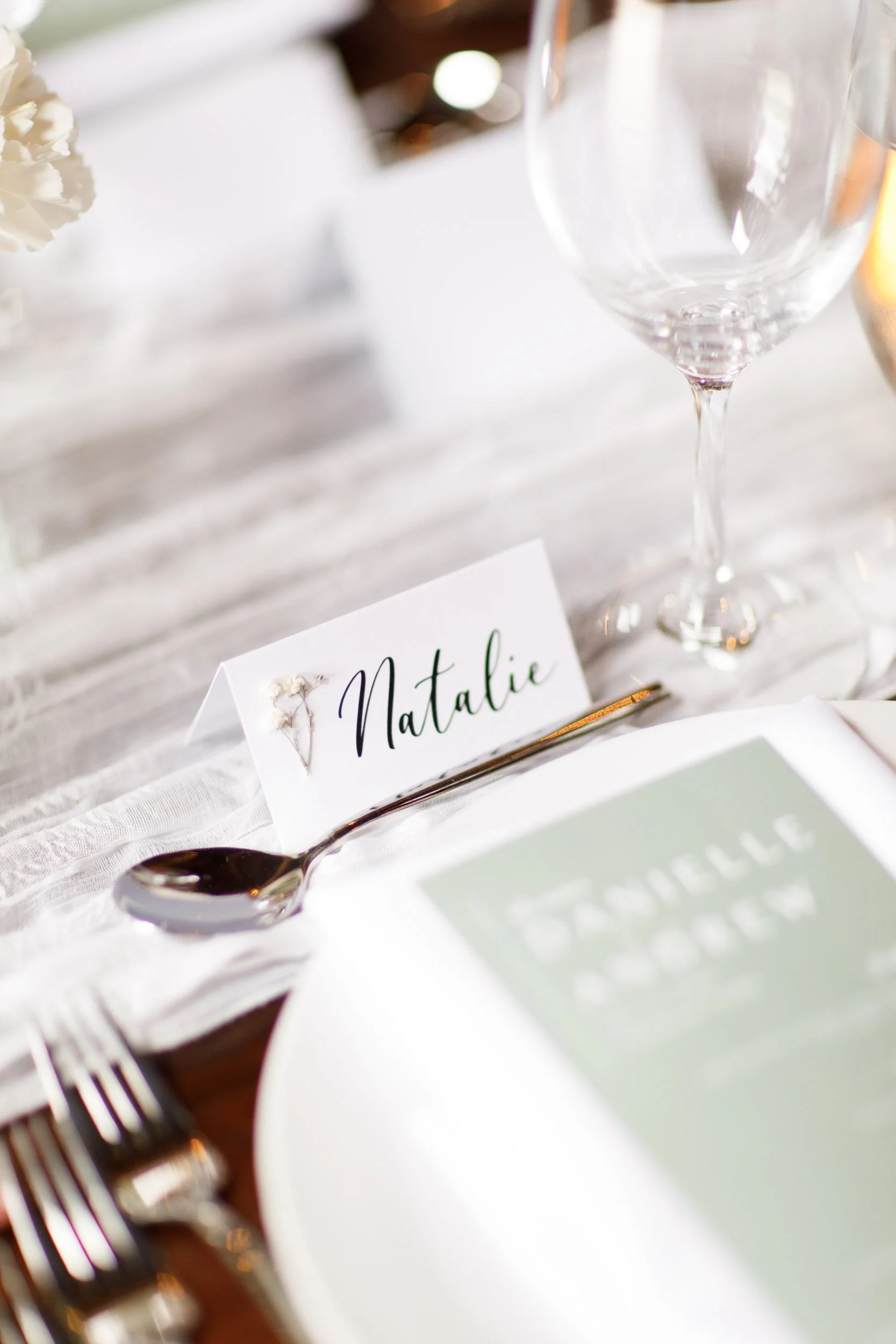 Wedding place setting and name card at a Cambium Farms wedding in Alton, Ontario