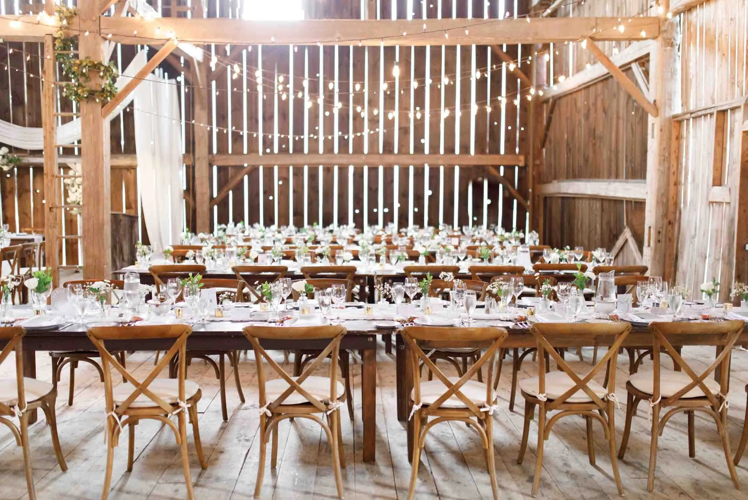 Long banquet tables set for dinner at Cambium Farms in Alton, Ontario