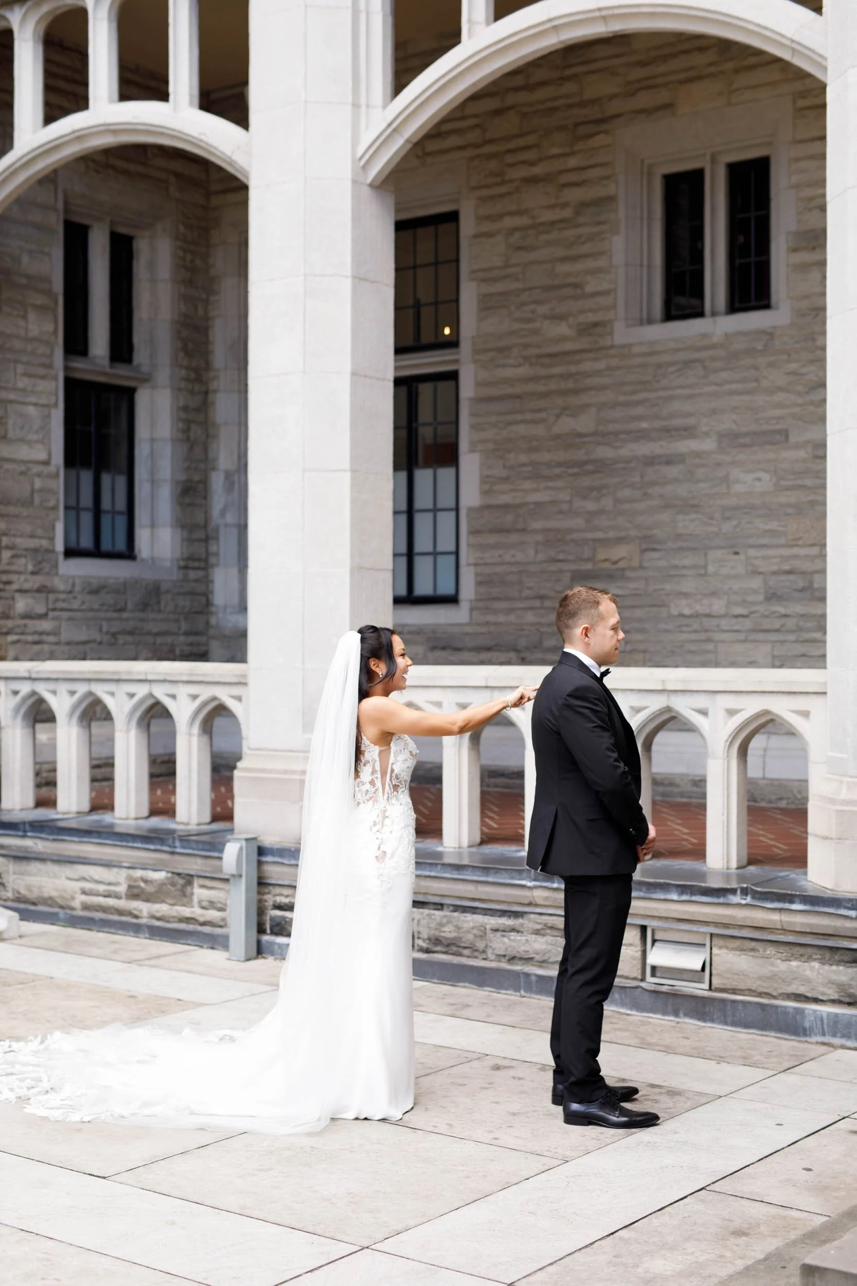Bride and groom meeting for their first look at Casa Loma in Toronto