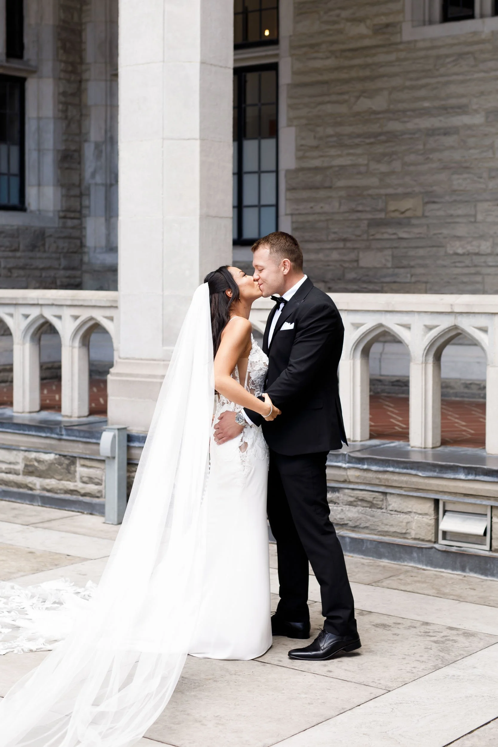 Bride and groom sharing a kiss during their Casa Loma first look in Toronto