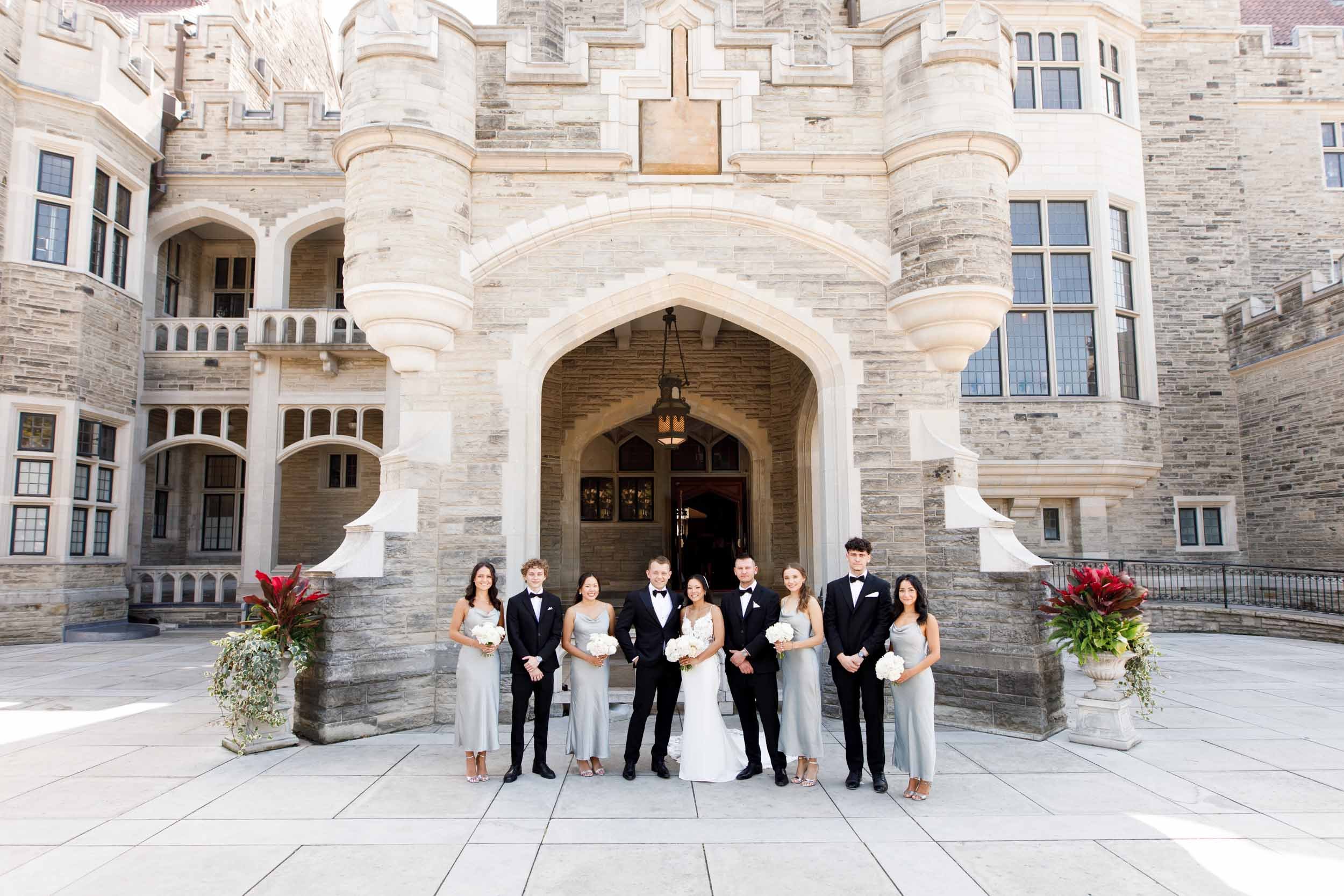 Wedding party in front of the Casa Loma entrance in Toronto