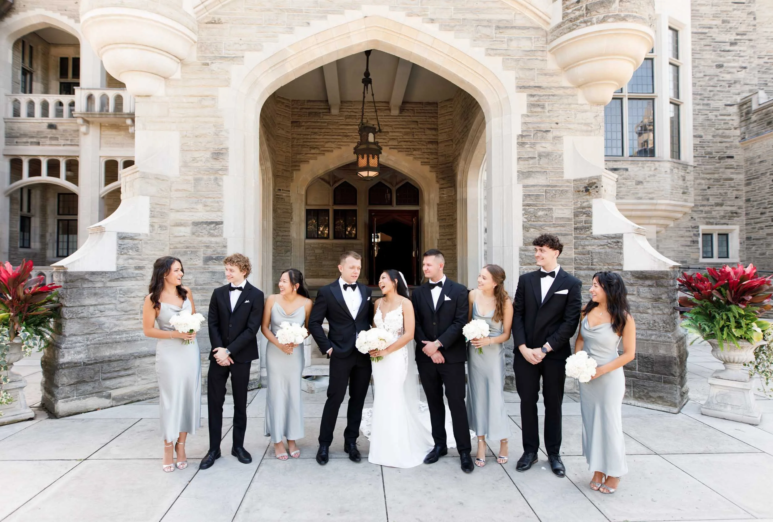 Wedding party walking together at Casa Loma in Toronto