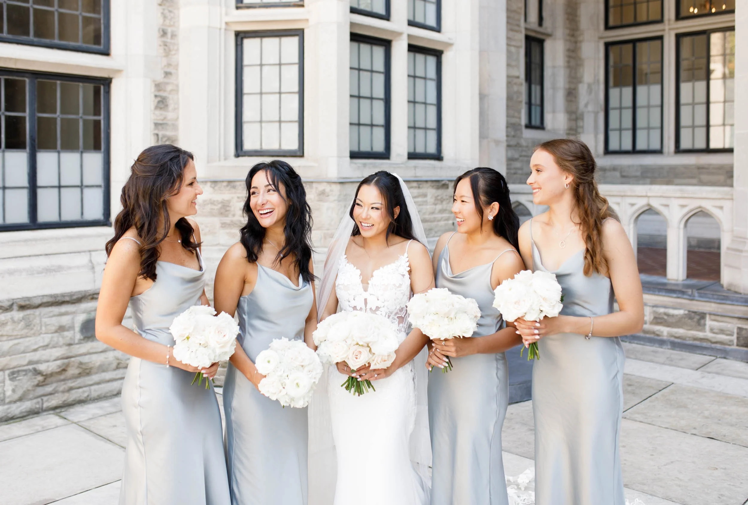 Bridesmaids smiling together at Casa Loma in Toronto