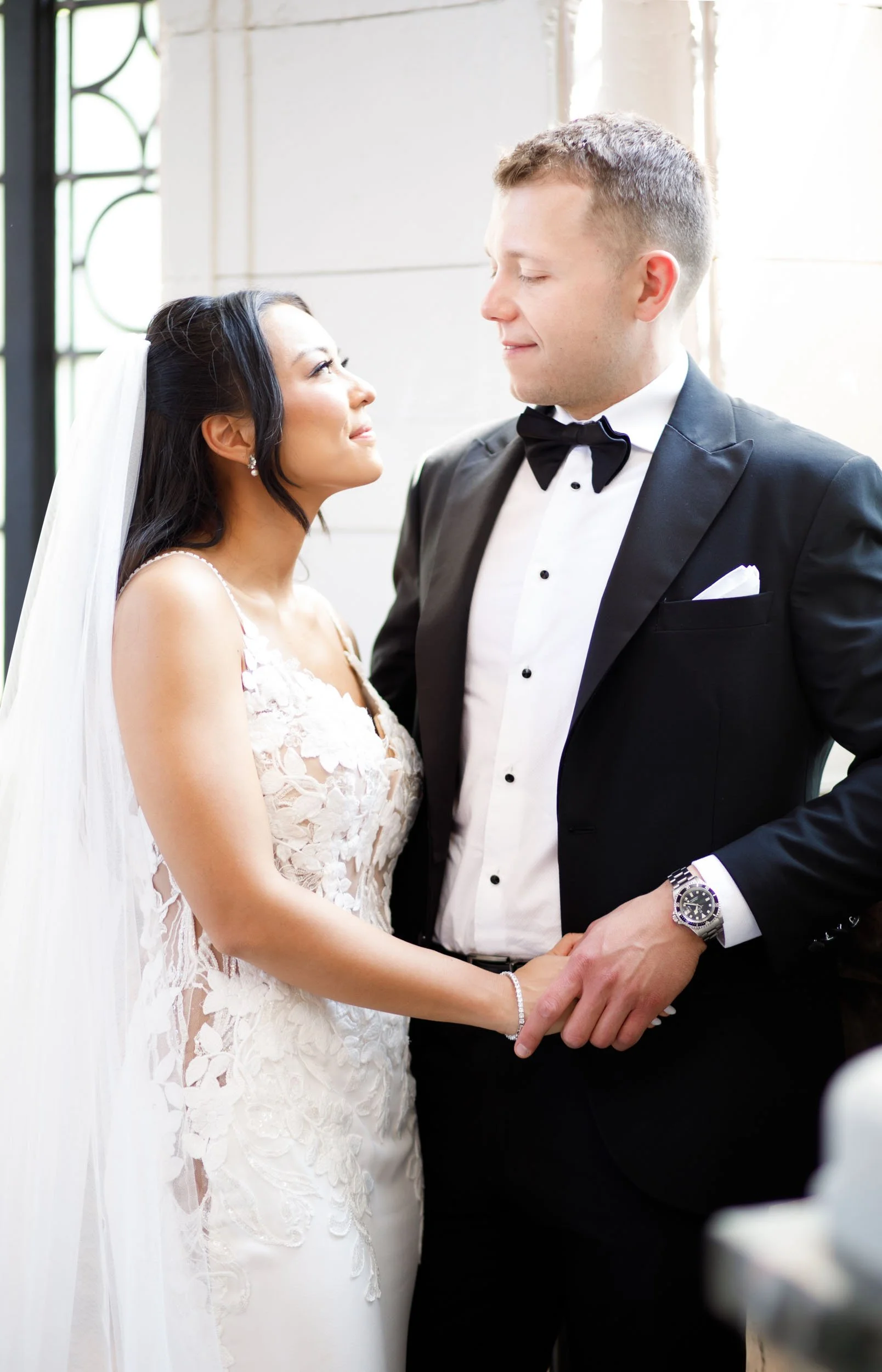 Bride and groom holding hands inside Casa Loma in Toronto