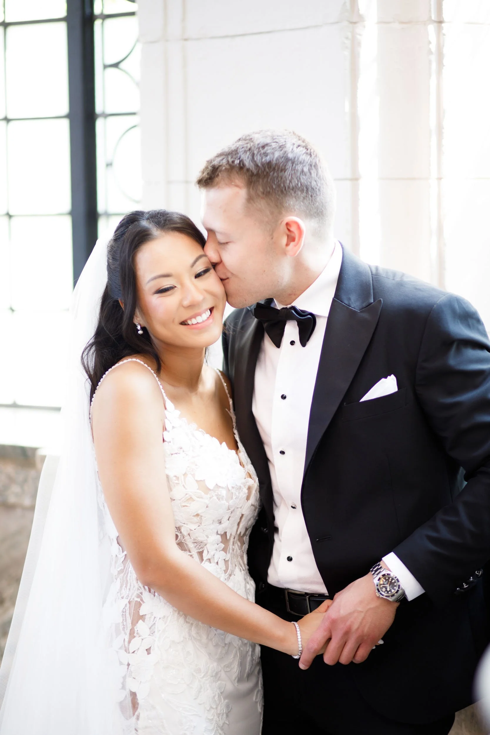 Bride and groom smiling together at Casa Loma in Toronto