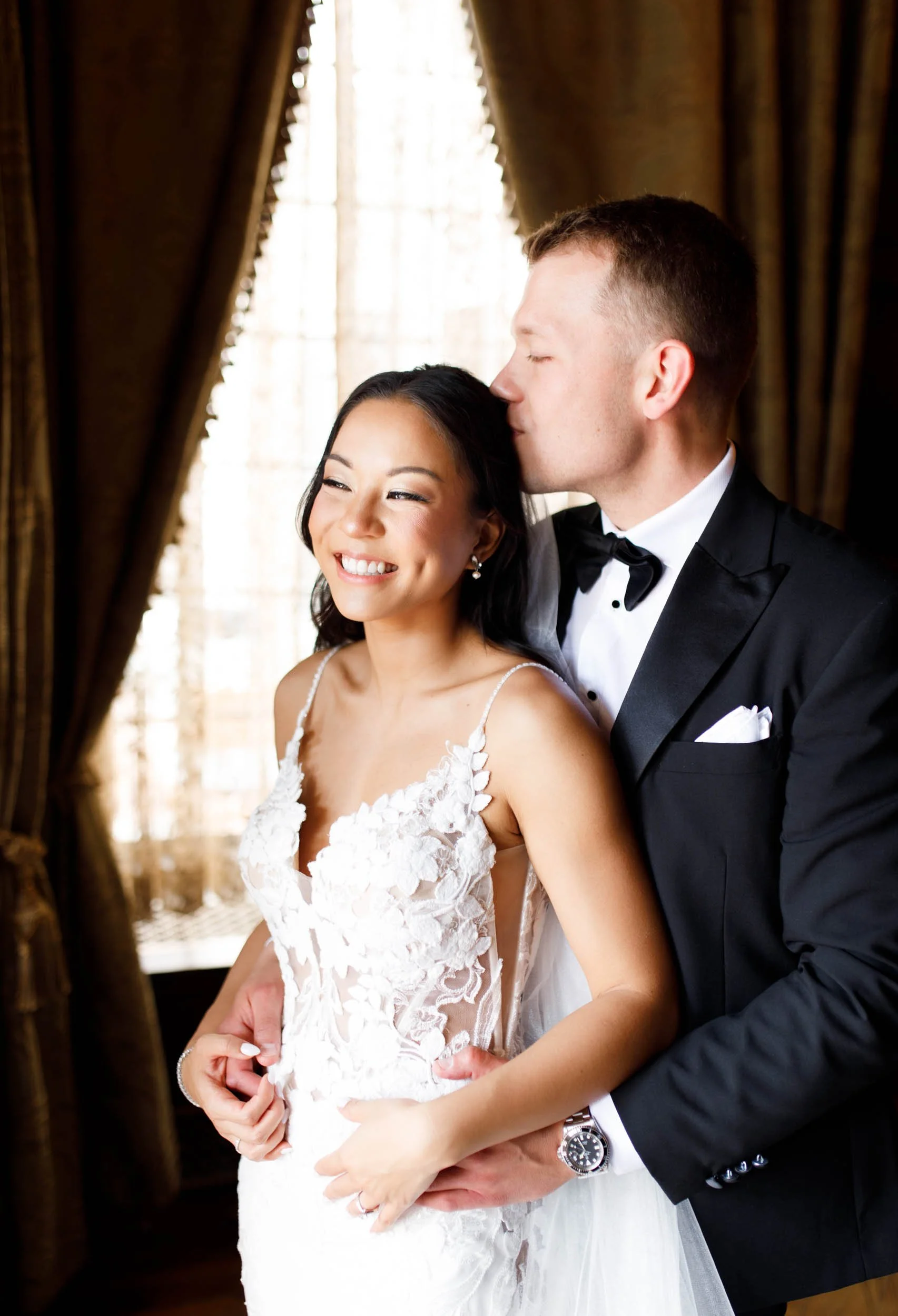 Bride and groom smiling together in the Casa Loma interior
