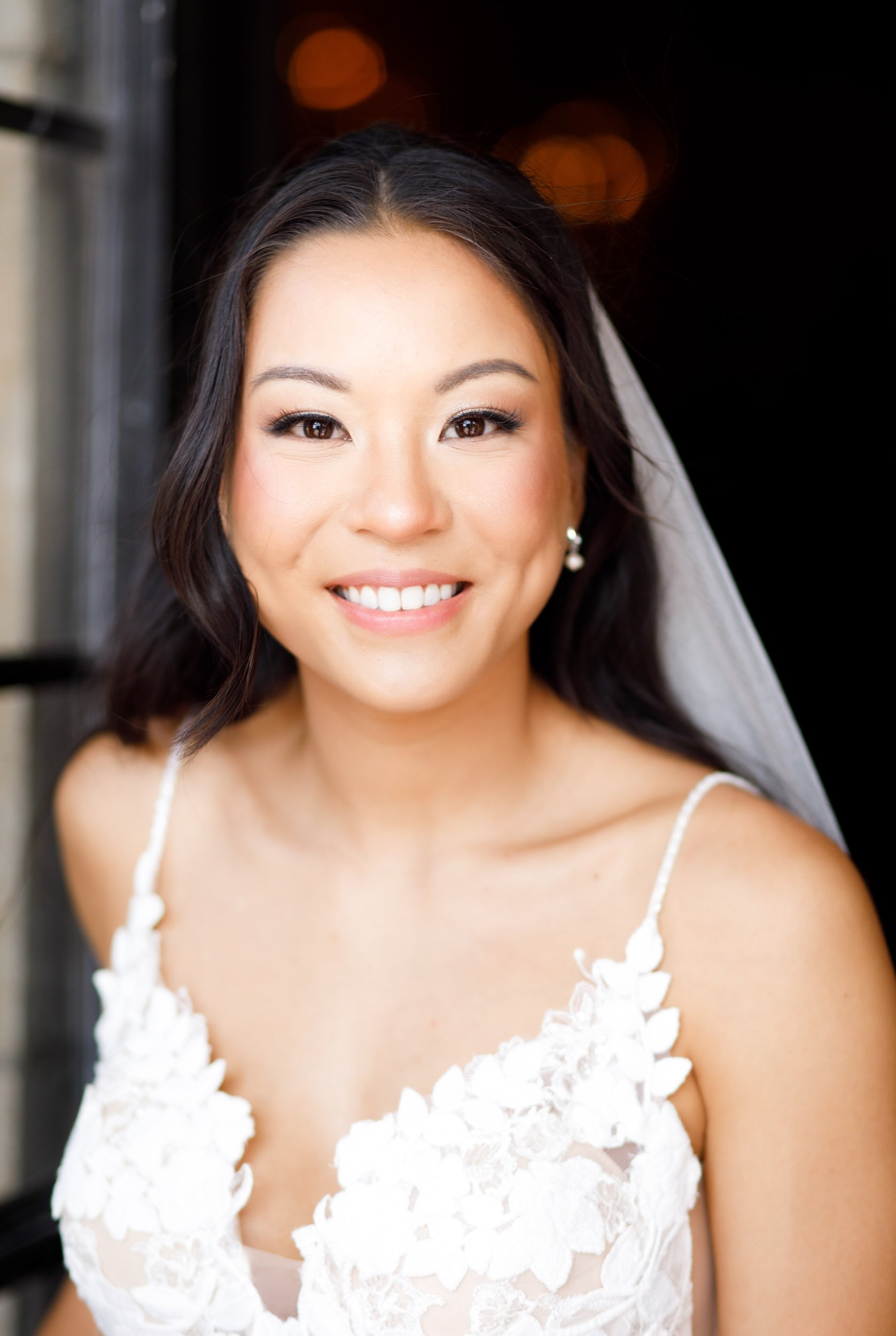 Bride smiling in the Casa Loma doorway