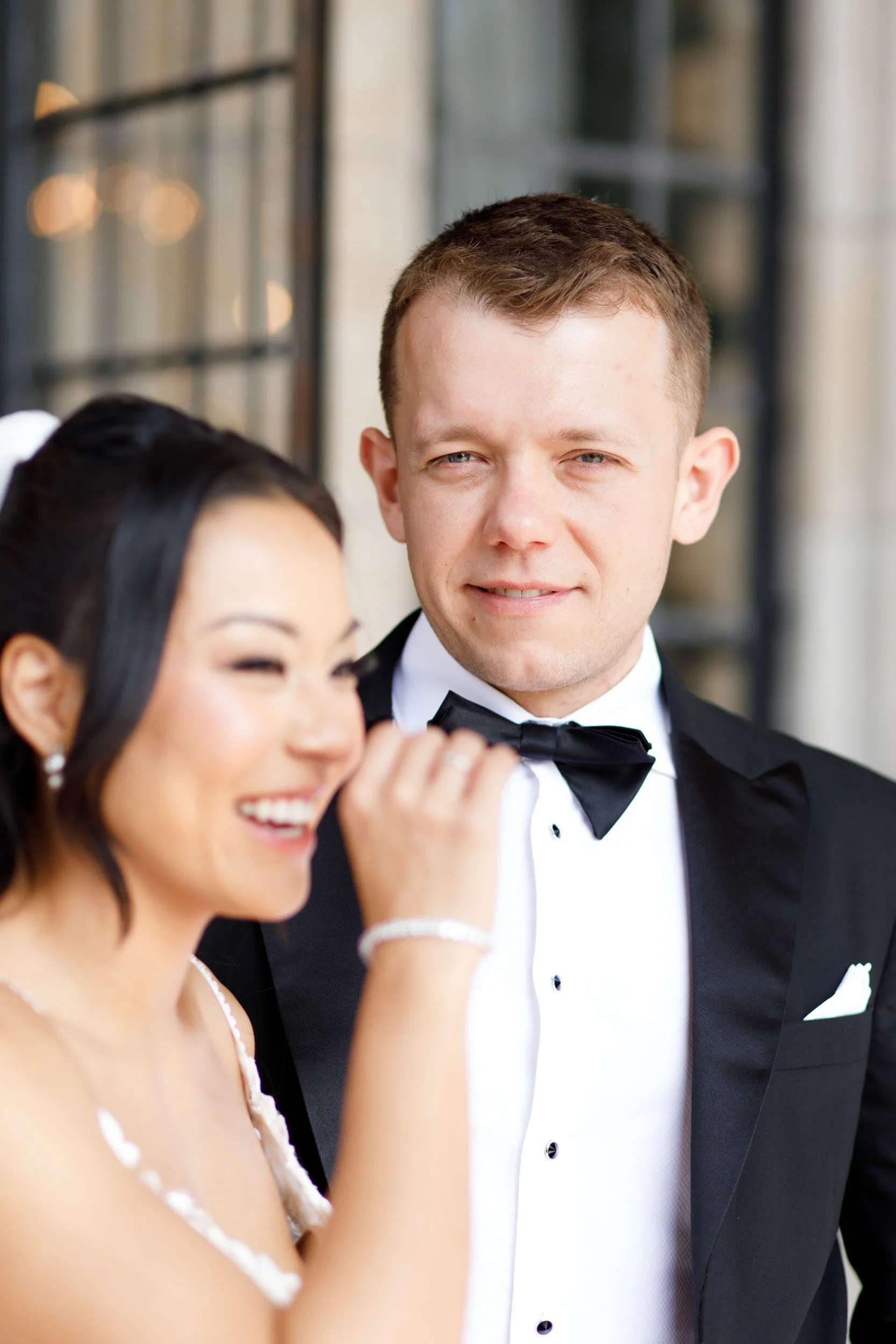 Bride and groom laughing together at Casa Loma